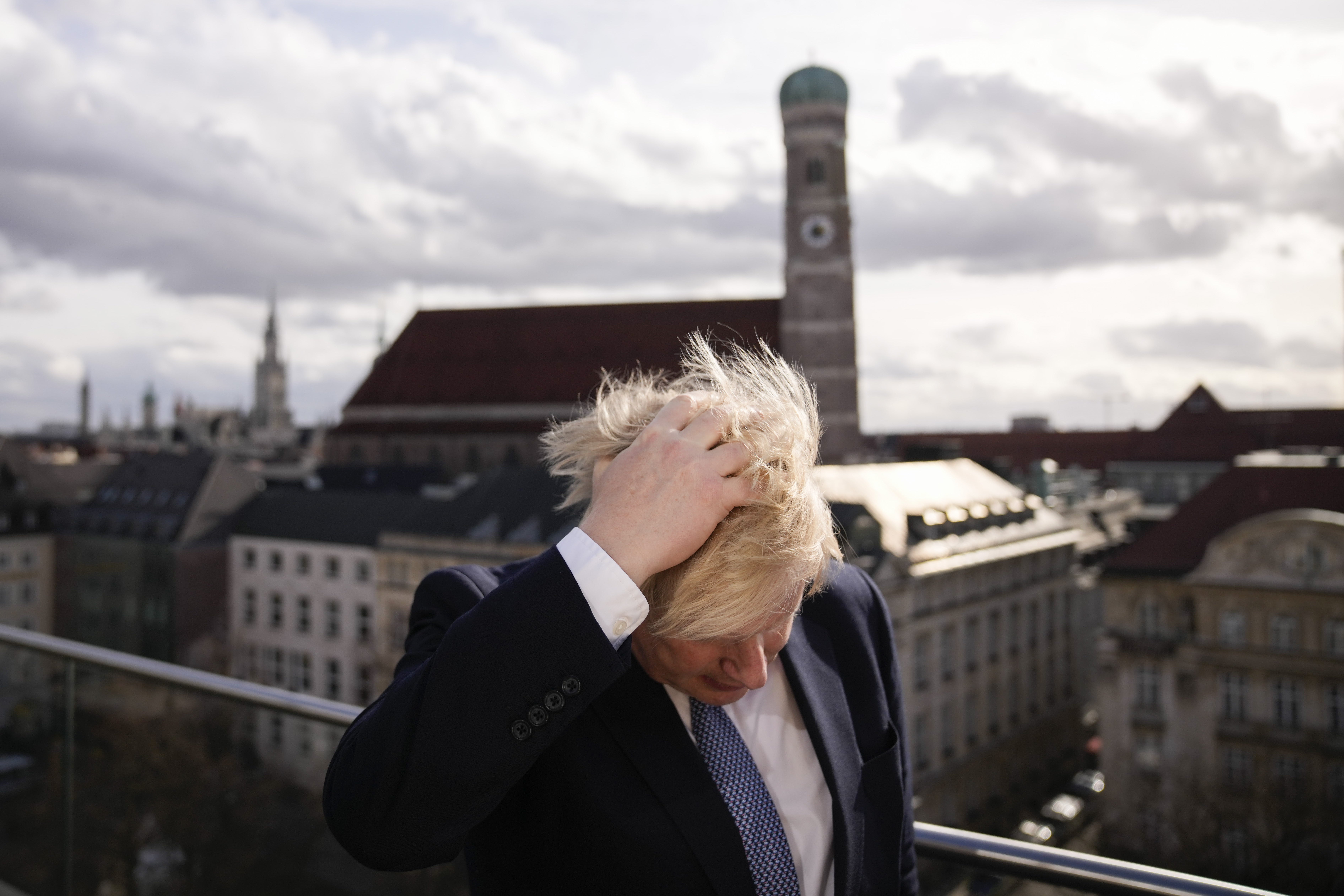 Prime Minister Boris Johnson rubbing his hair to get ready for a interview during the Munich Security Conference in Germany where he is meeting with world leaders to discuss tensions in eastern Europe. Picture date: Saturday February 19, 2022.