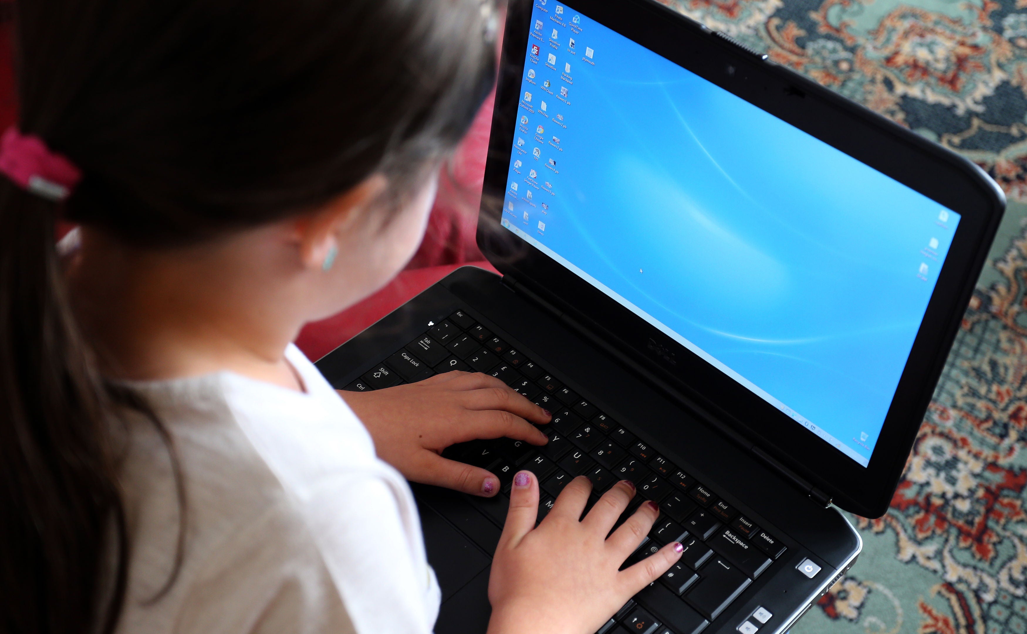 A child using a laptop computer (PA)