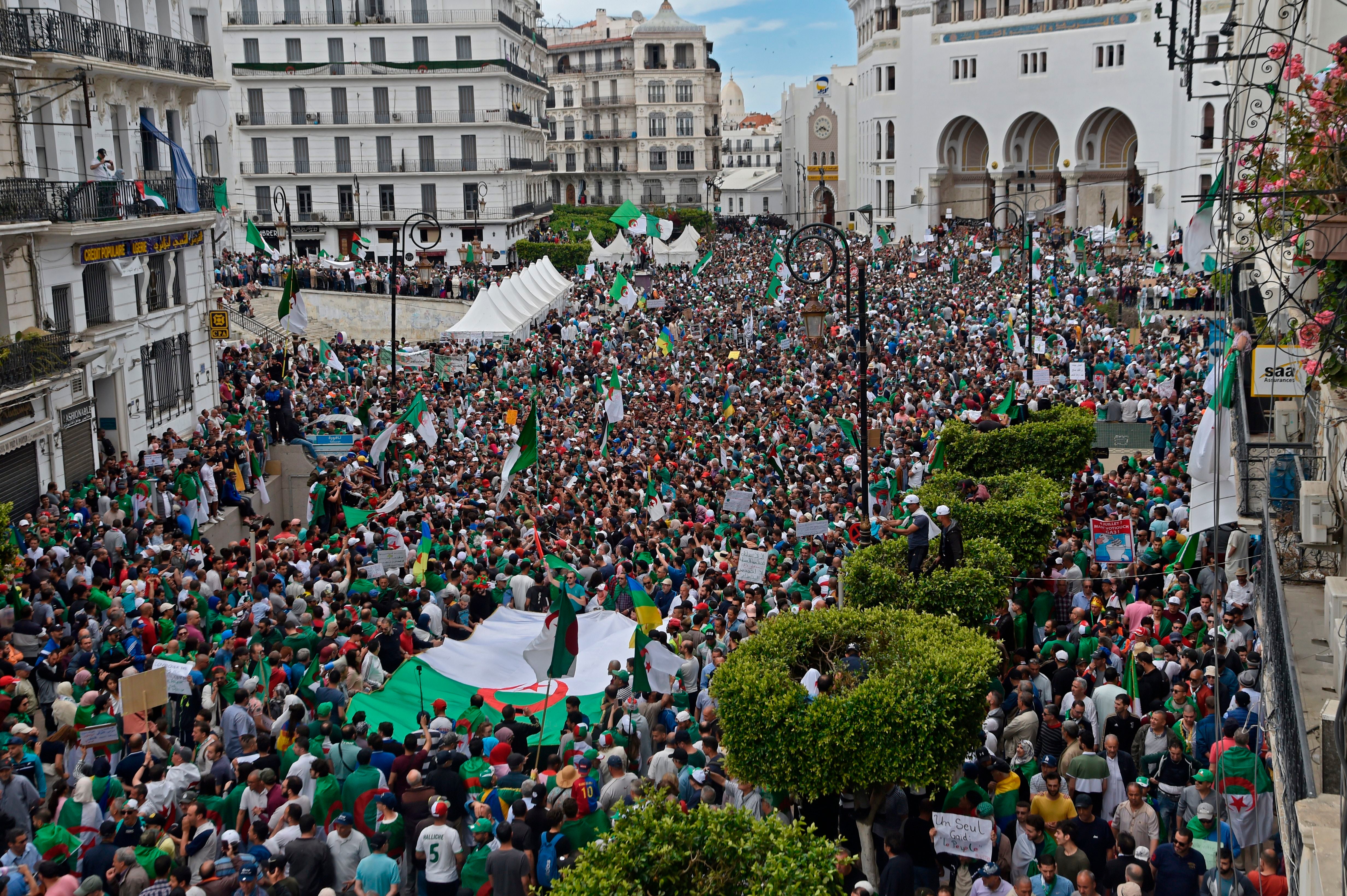 Algerian protesters gather during an anti-government demonstration outside La Grande Poste (main post office) in the centre of the capital Algiers on 17 May 2019