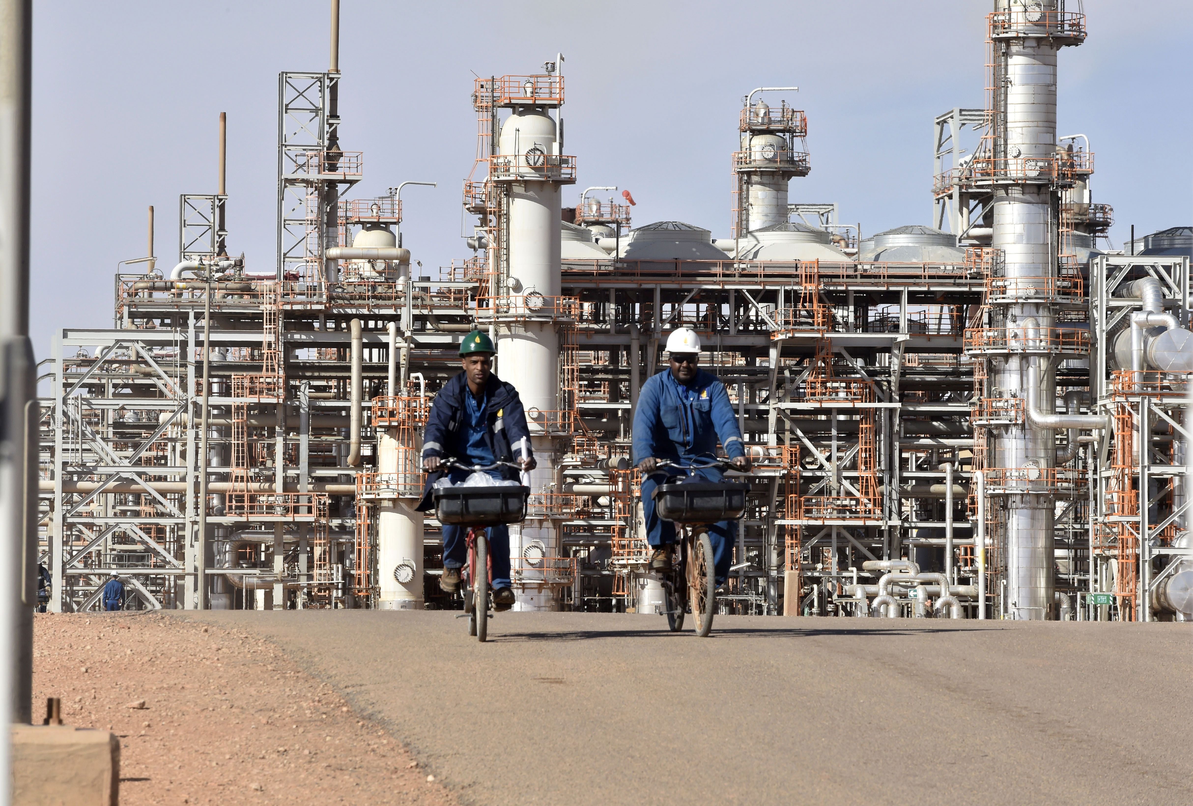 File photo: Workers ride bicycles at Amenas gas plant, 1,300km (800 miles) southeast of Algiers, 16 January 2018