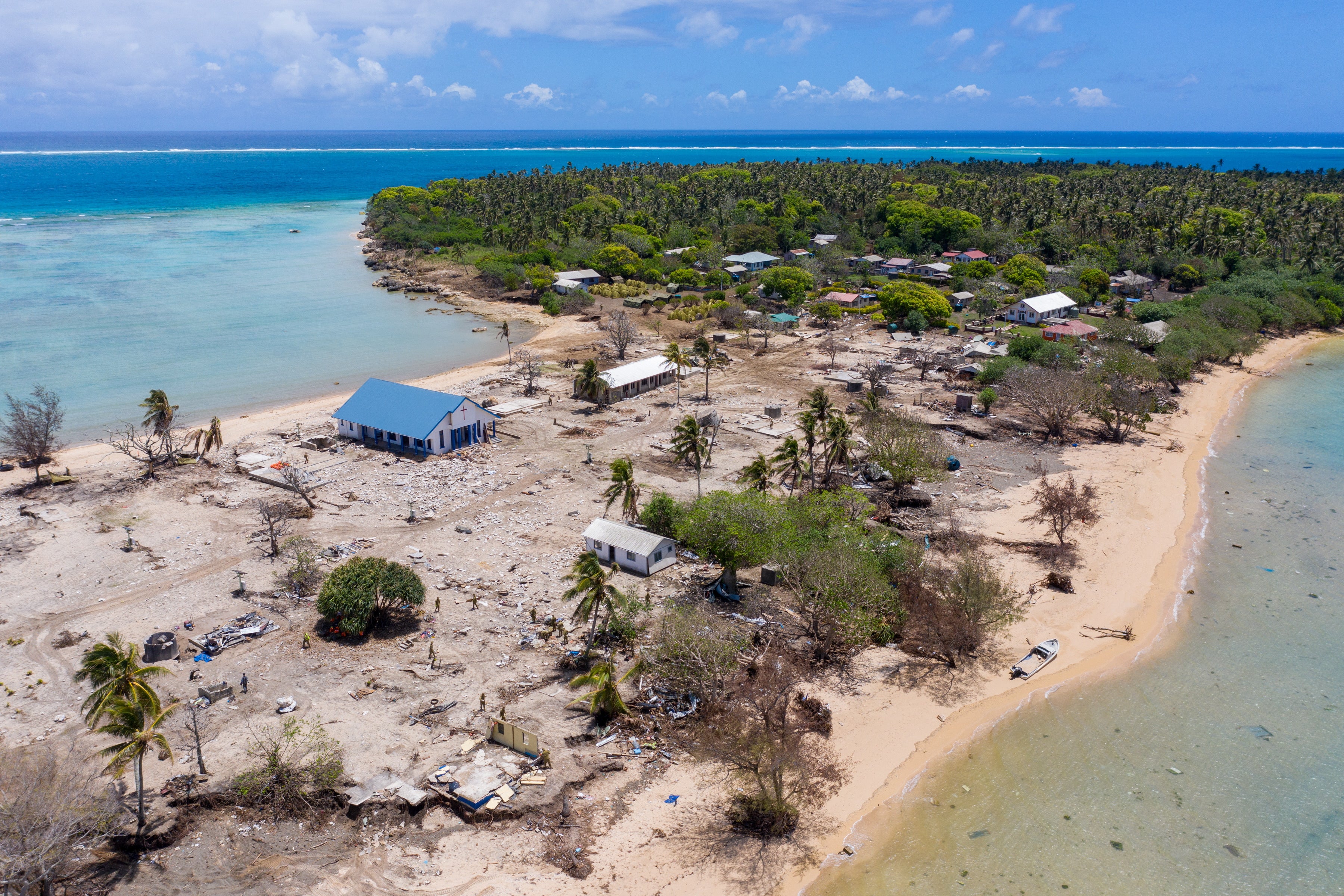 An aerial view of clearance operations on Atata Island, Tonga, 11 February 2022