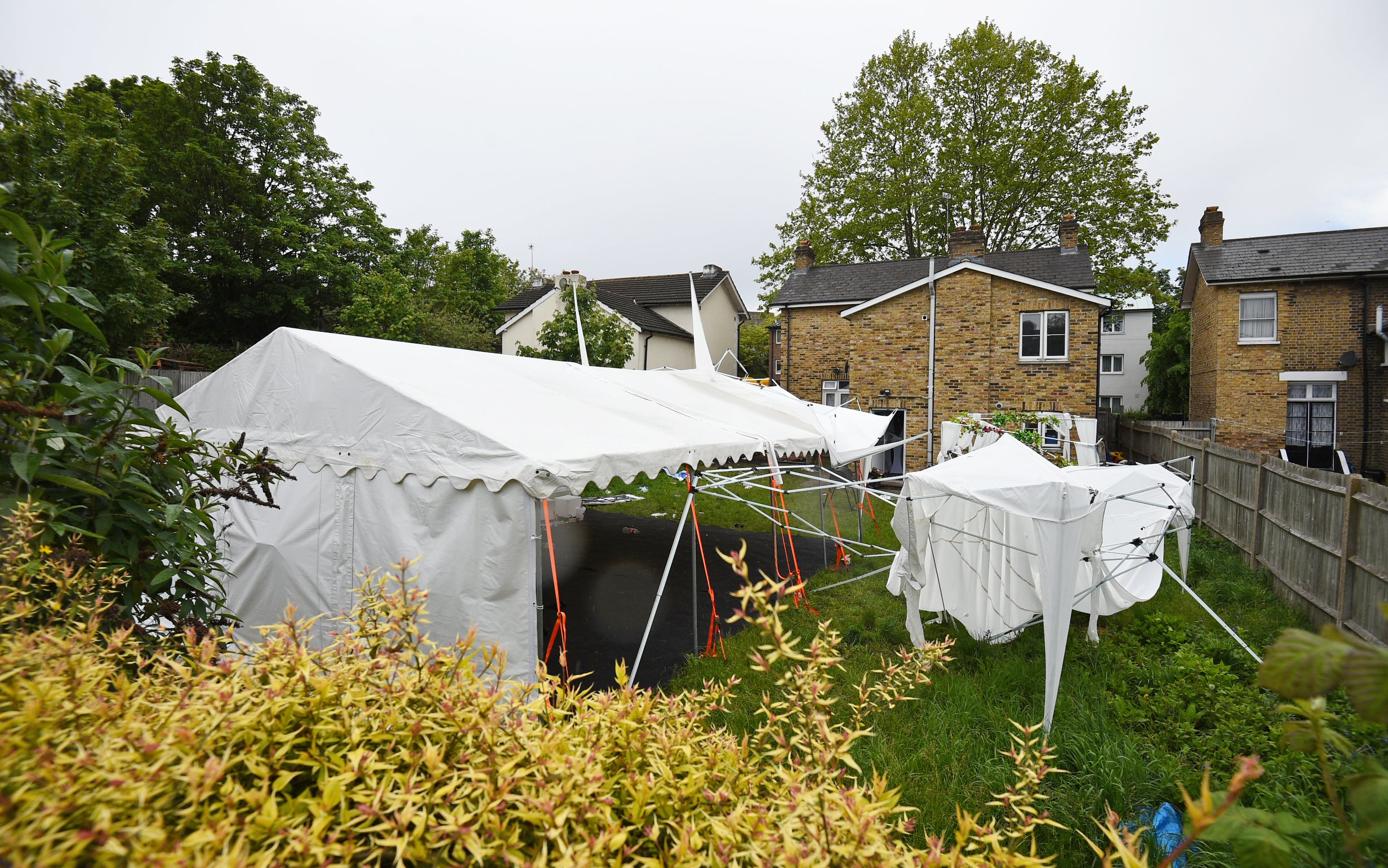 A tent in the garden of a house in Consort Road, Peckham, southeast London, which is being guarded by police officers investigating the shooting of black equal rights activist and mother-of-three Sasha Johnson (Kirsty O’Connor/PA)