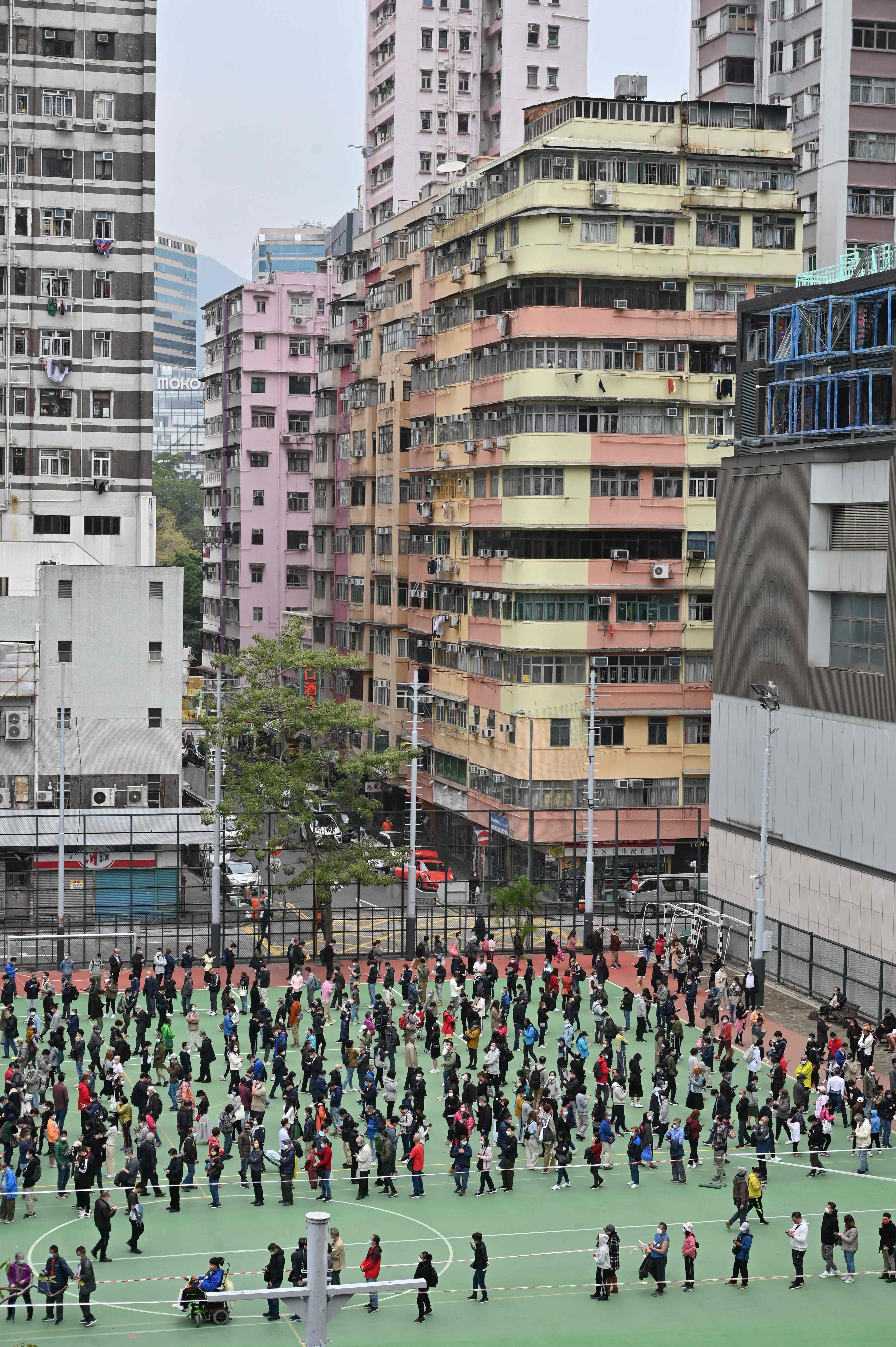 People queue for Covid-19 tests in Hong Kong's Mongkok district