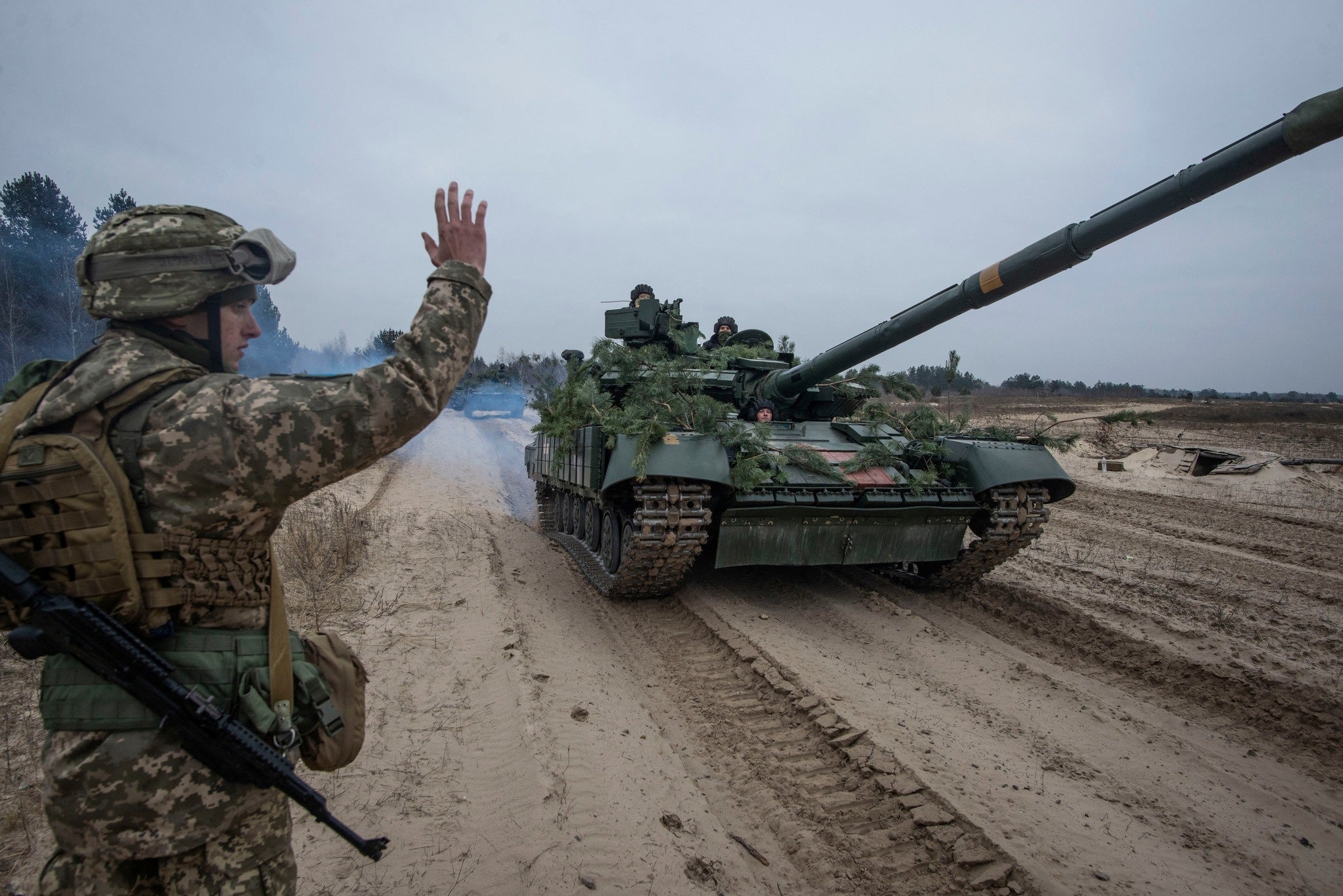 Ukrainian service members take part in tactical drills at a training ground in an unknown location in Ukraine