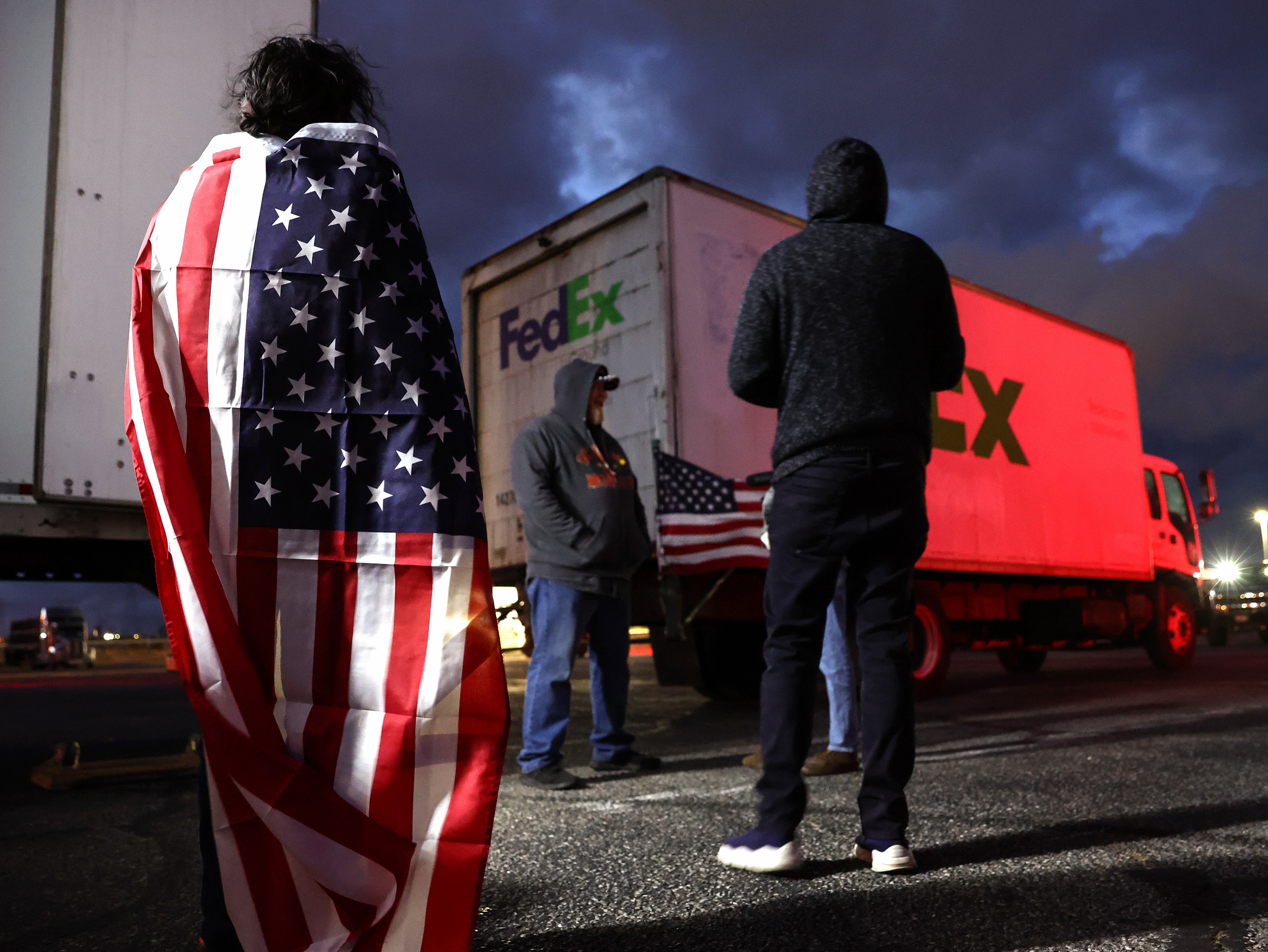 Truck-borne protesters gather before departure in Adelanto, California on 22 February