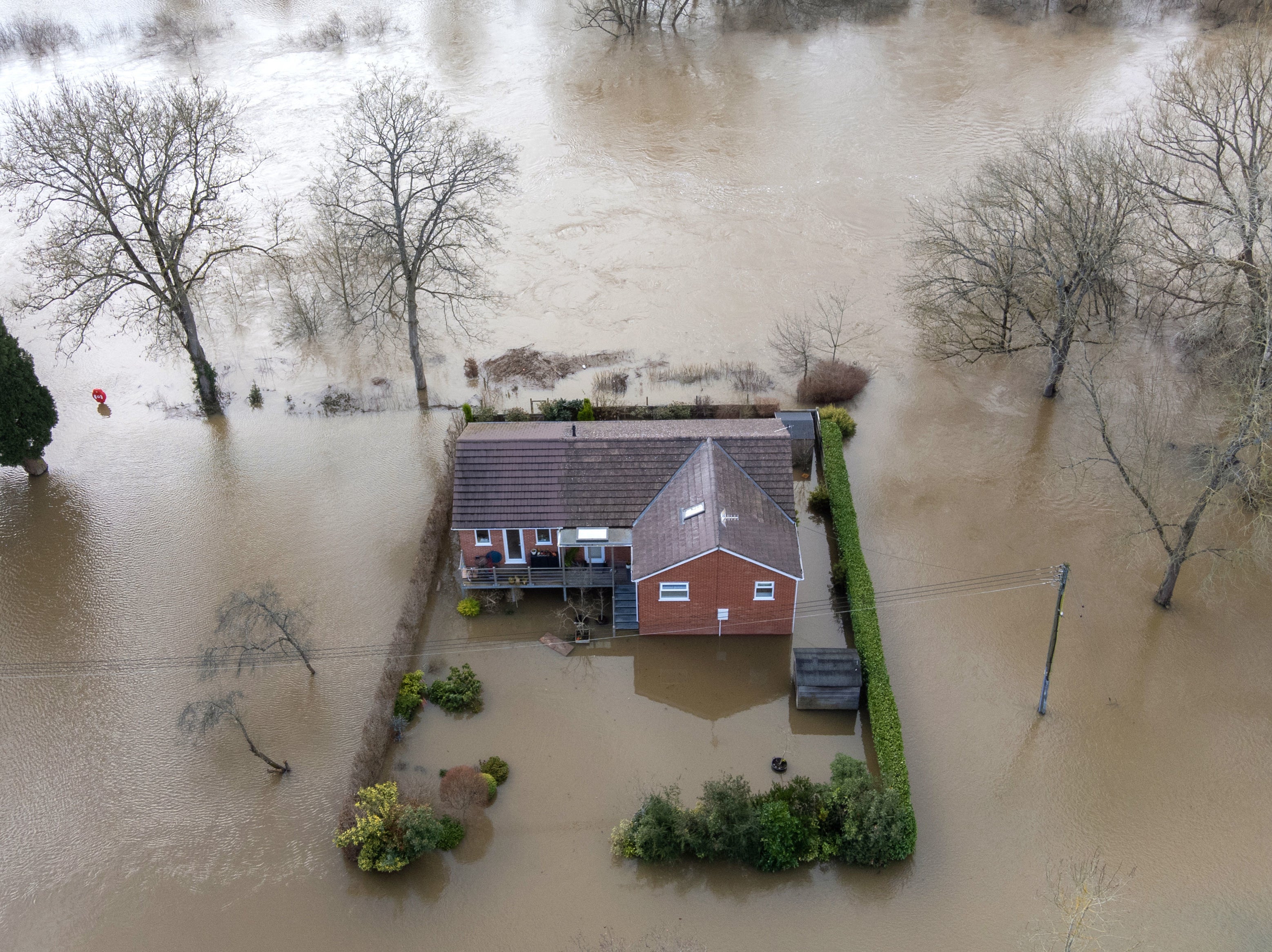 A property surrounded by floodwater after the River Severn burst its banks at Bewdley in Worcestershire, 22 February 2022