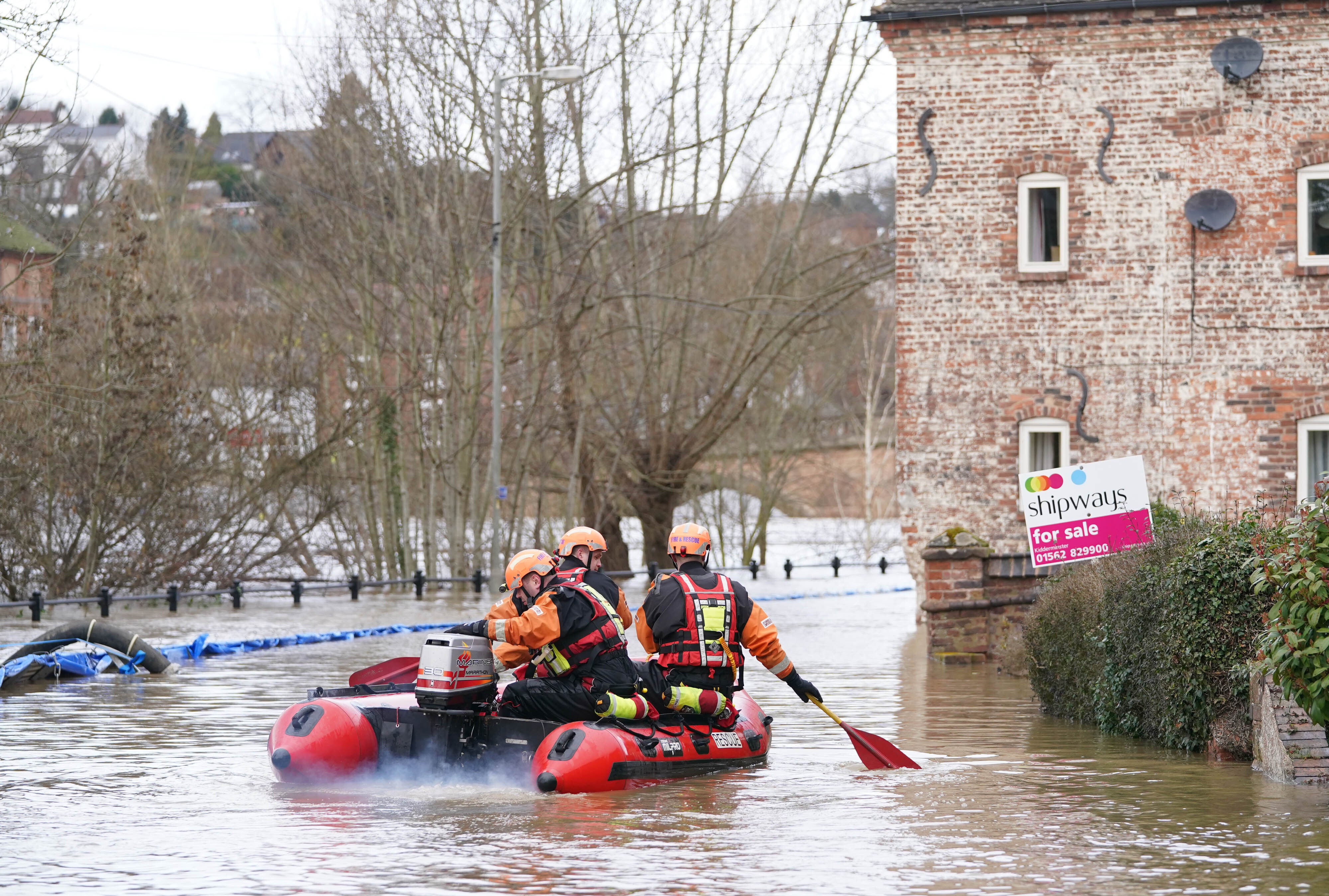 A fire and rescue team in floodwater in Bewdley, Worcestershire (Joe Giddens/PA)