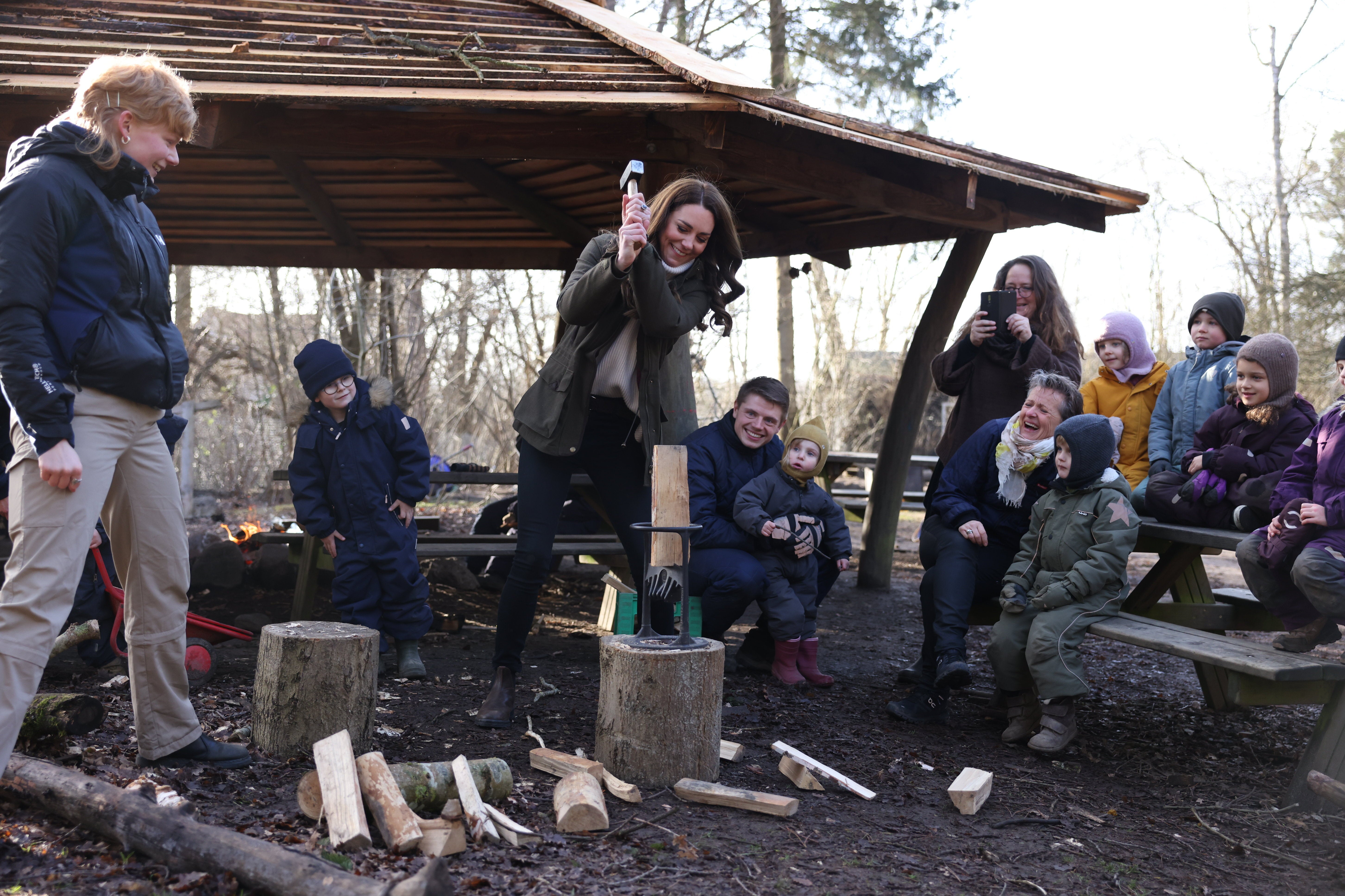 The Duchess of Cambridge chops a log during a visit to Stenurten Forest Kindergarten in Copenhagen, Denmark (Ian Vogler/Daily Mirror/PA)