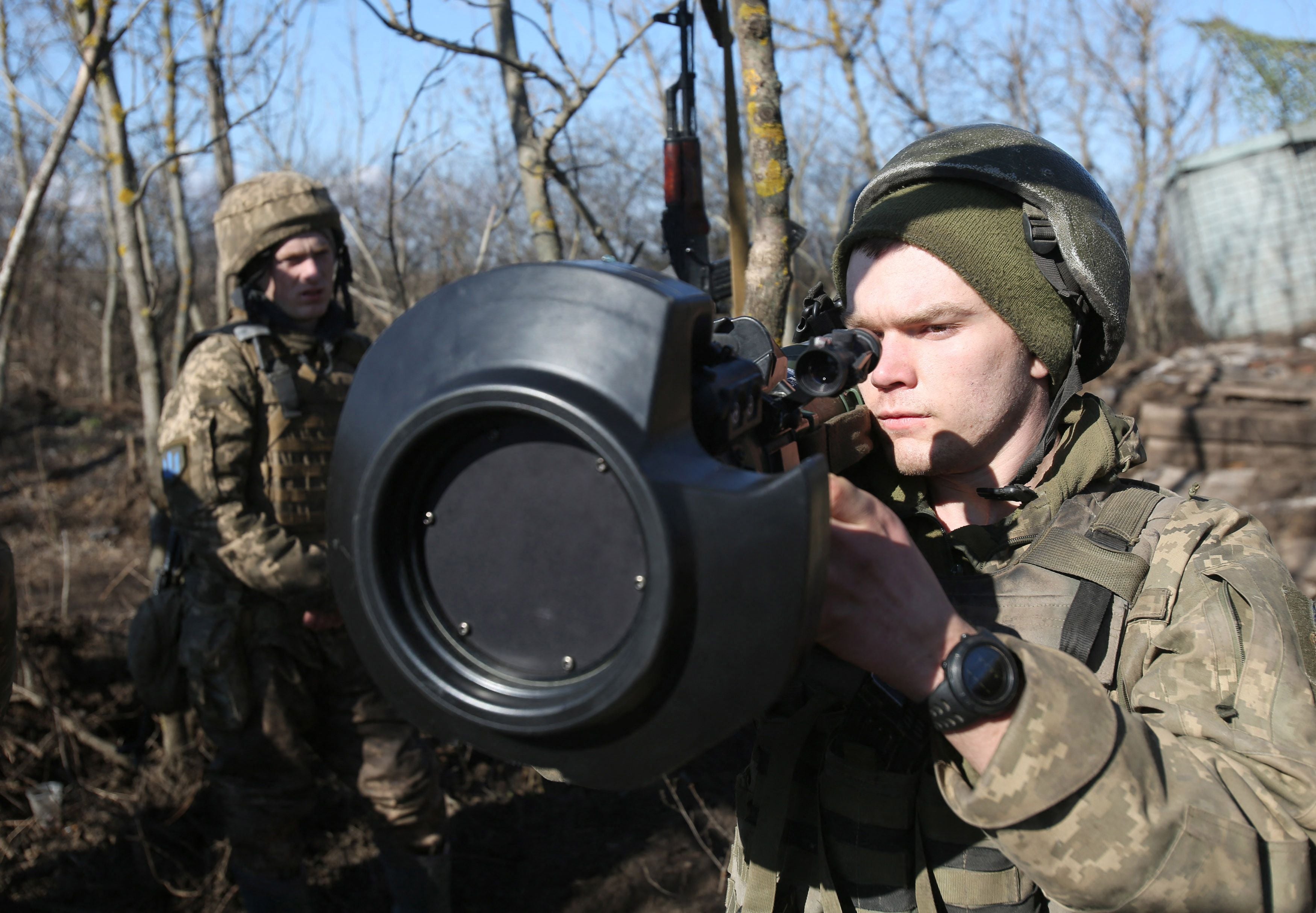 Servicemen of Ukrainian Military Forces on the front-line with Russia-backed separatists near Novognativka village, Donetsk region, examine a Swedish-British portable anti-tank guided missile