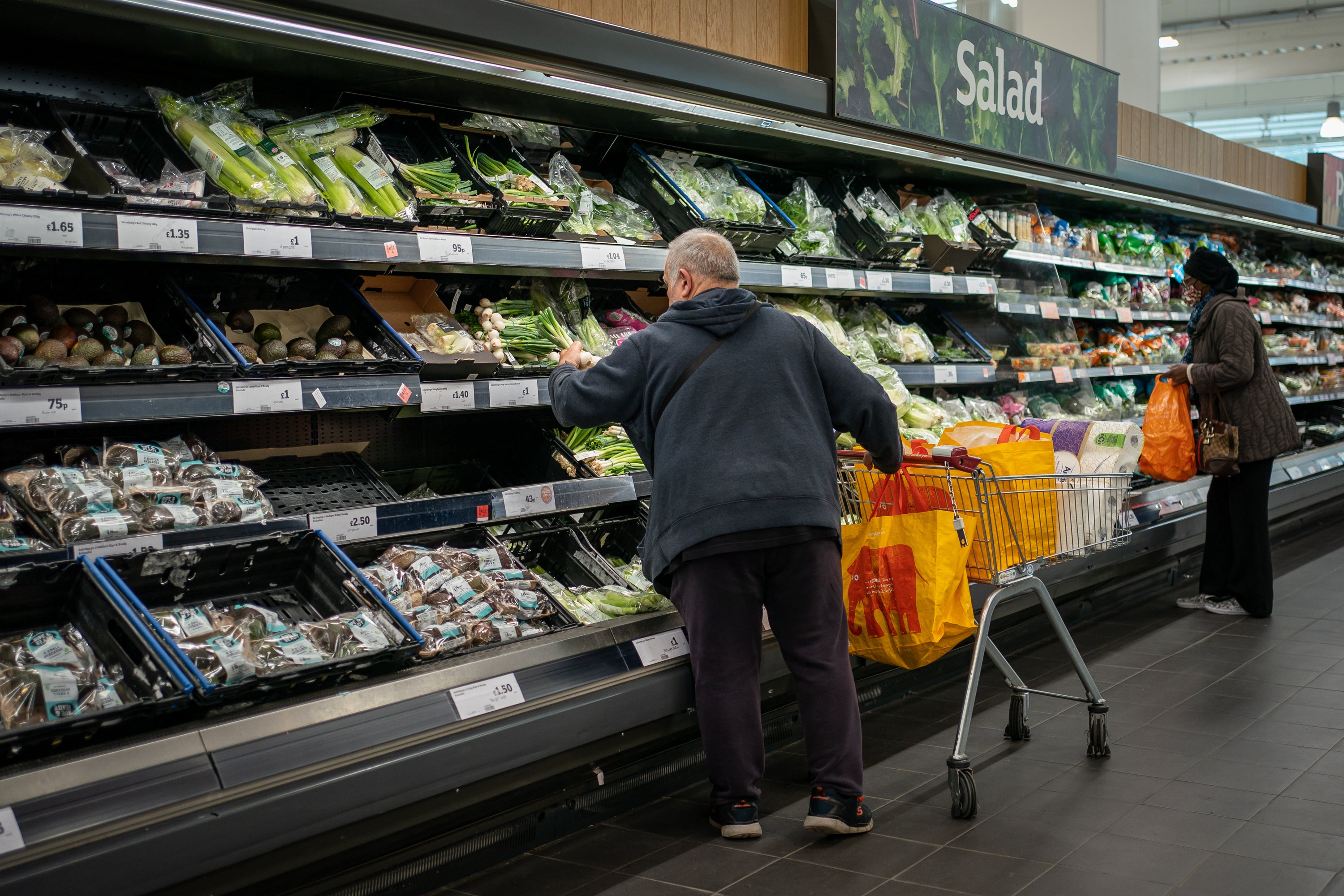 Shoppers in the fruit and vegetable section of a supermarket (Aaron Chown/PA)