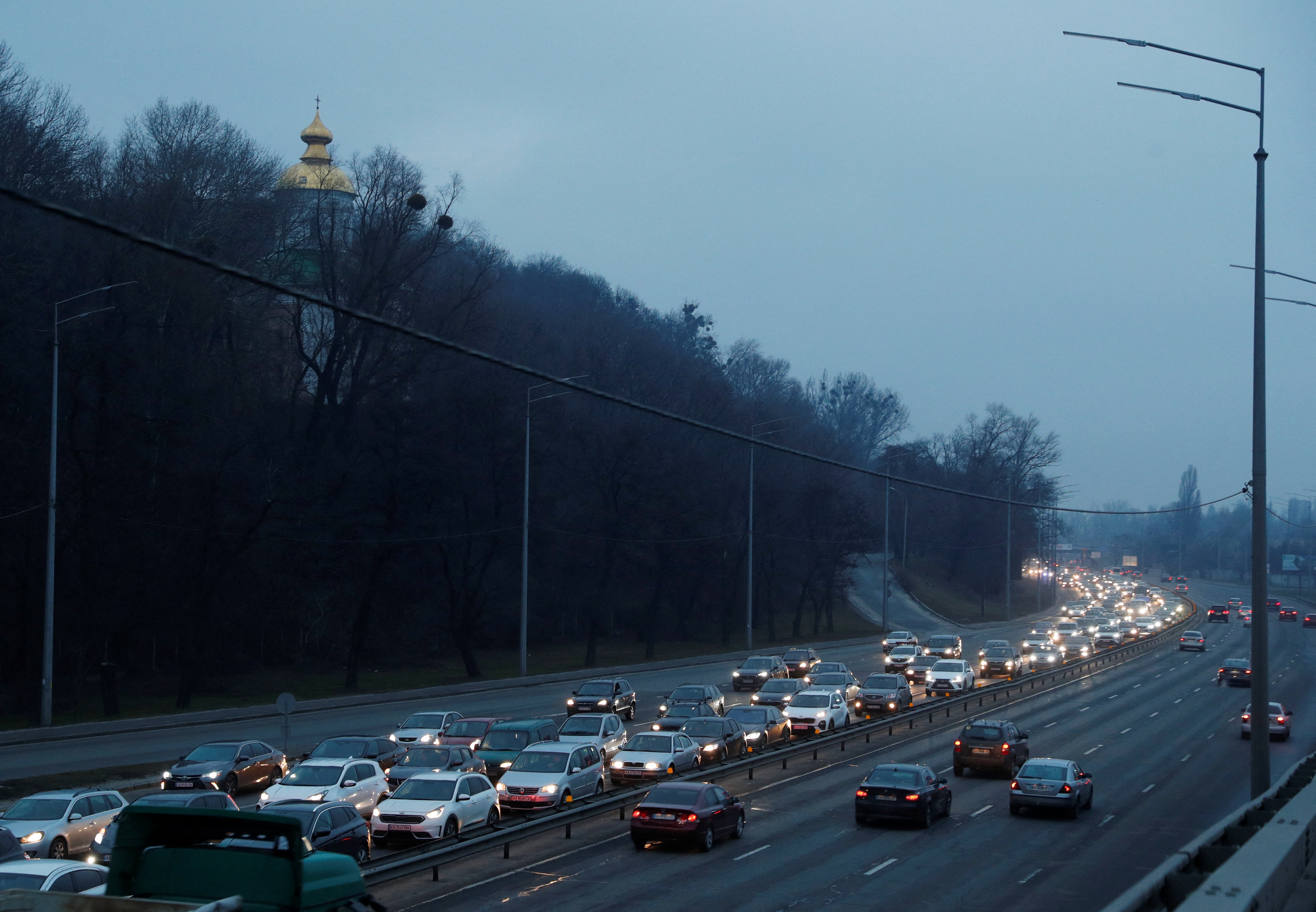 A steady stream of cars leaving Kyiv