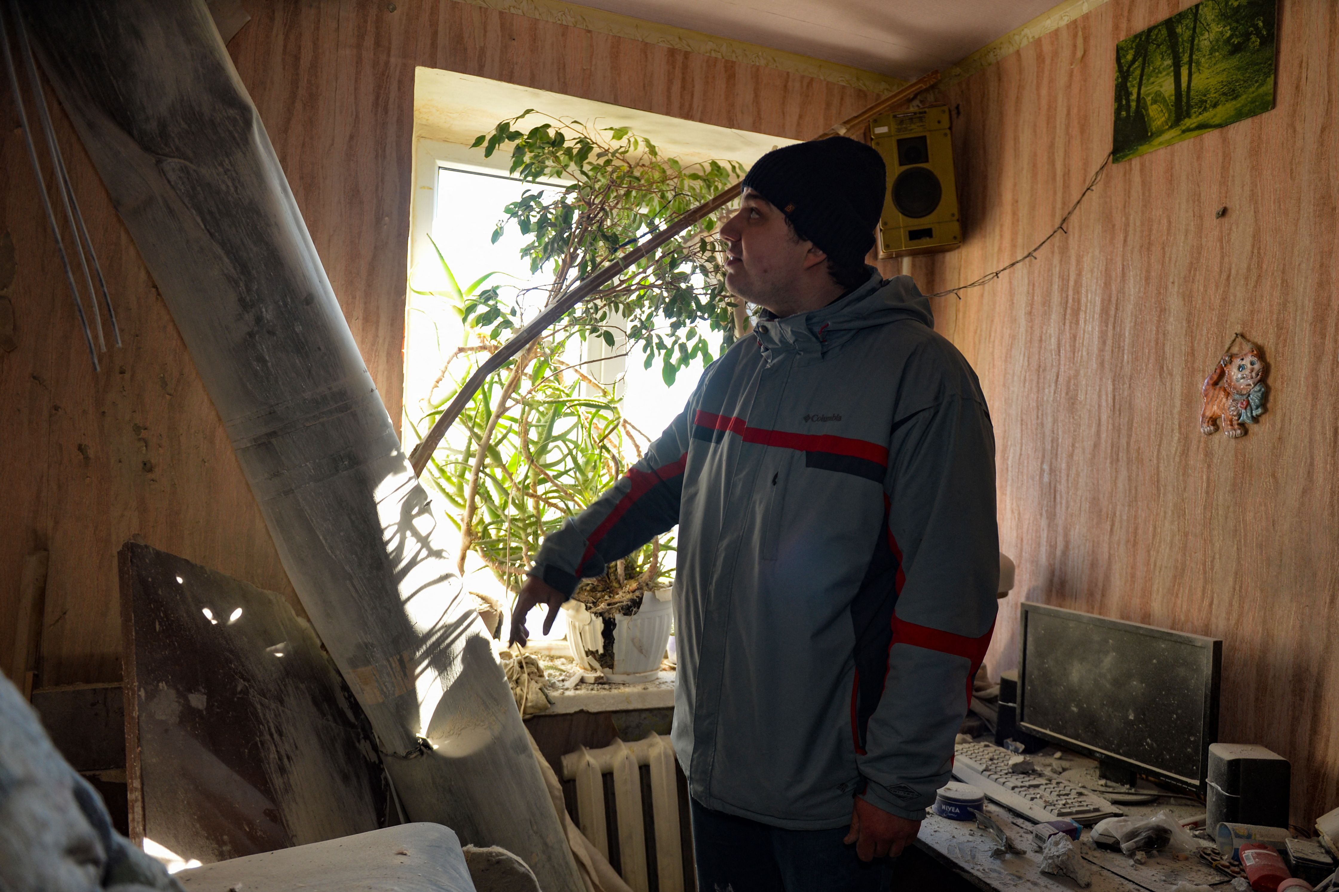 The body of a rocket stuck in a flat after recent shelling on the northern outskirts of Kharkiv on 24 February 2022