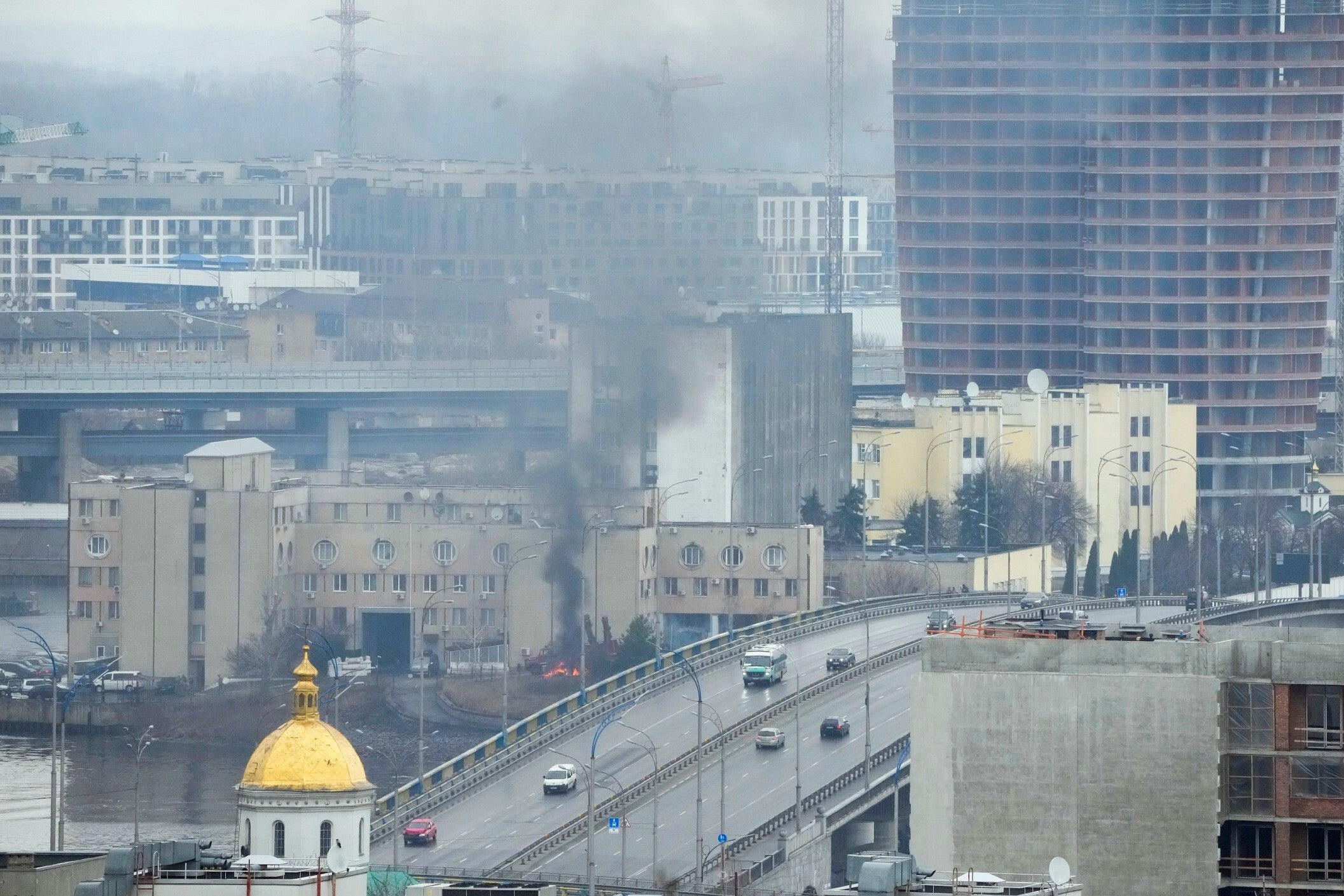 Smoke and flame rise near a military building after an apparent Russian strike in Kyiv, Ukraine, Thursday, 24 February 2022