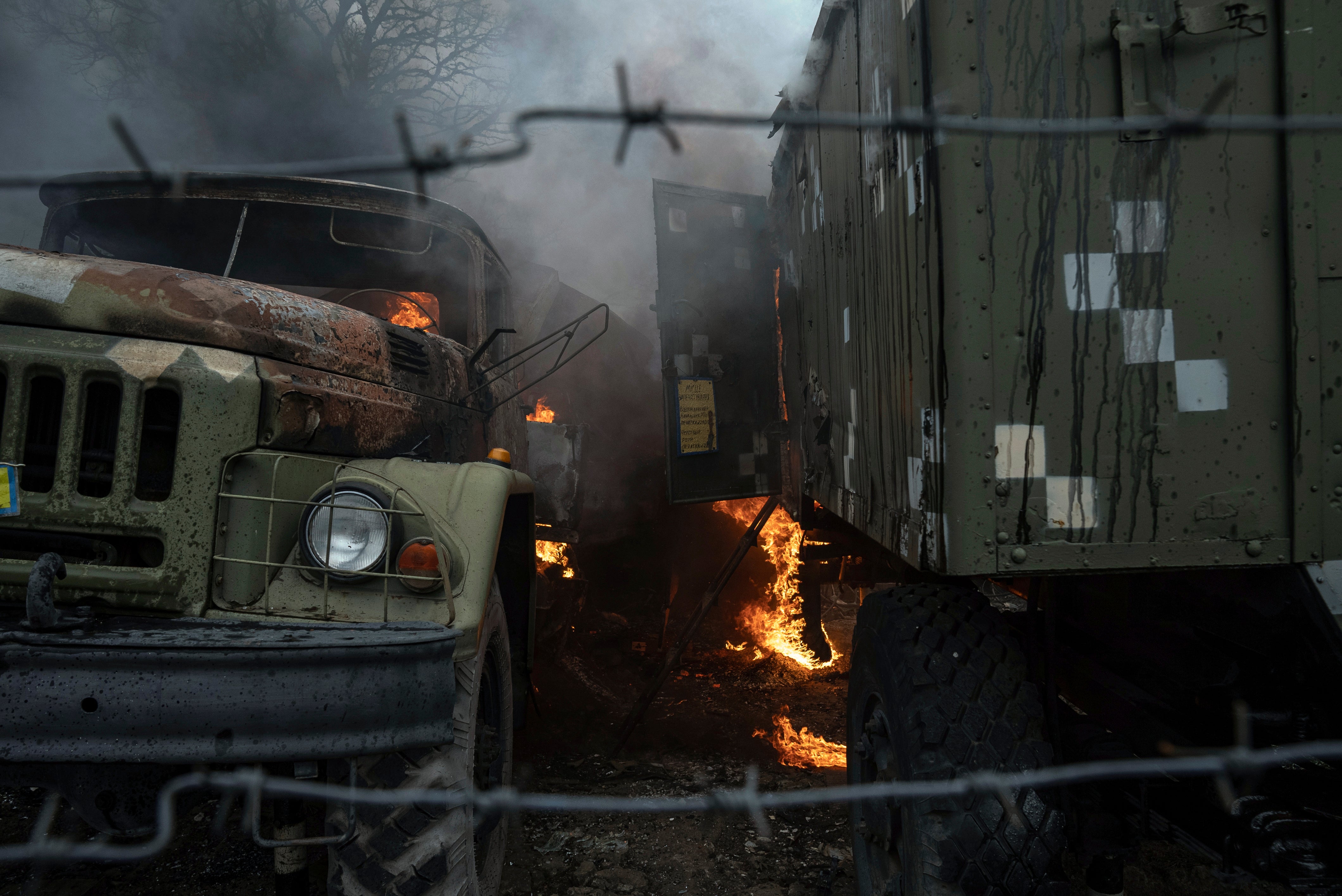 Ukrainian military track burns at an air defence base in the aftermath of an apparent Russian strike in Mariupol, Ukraine, Thursday, 24 February 2022