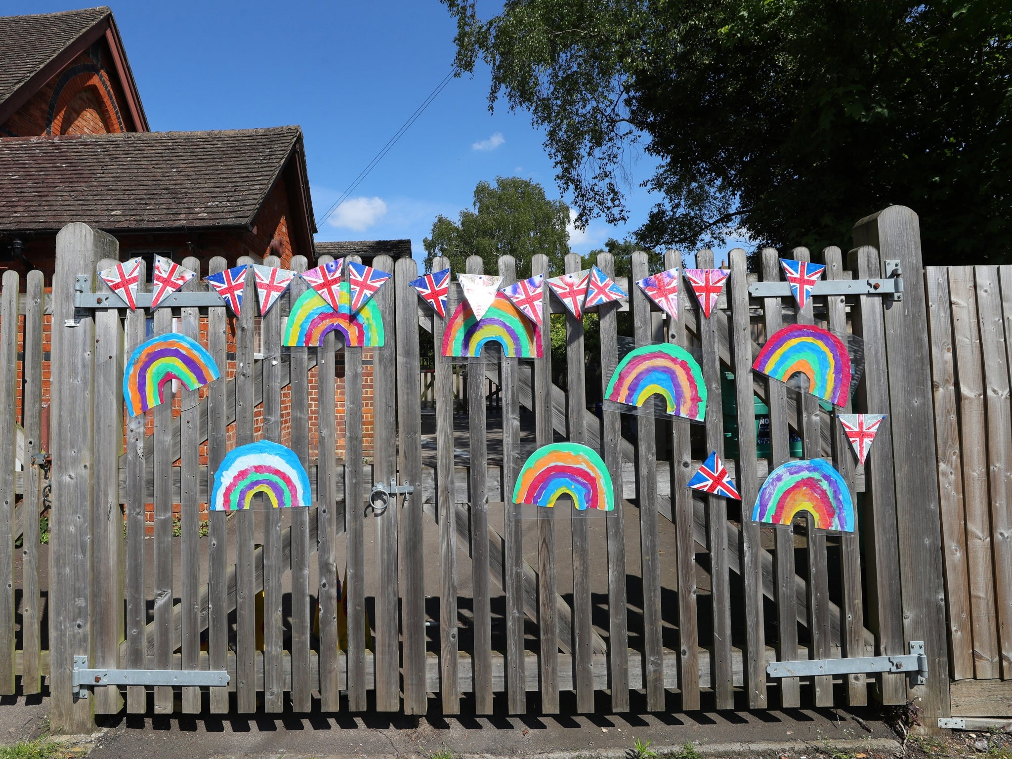 The gates of Mursley school decorated with home made Union Jack bunting and rainbows for the NHS and Key Workers on May 08, 2020