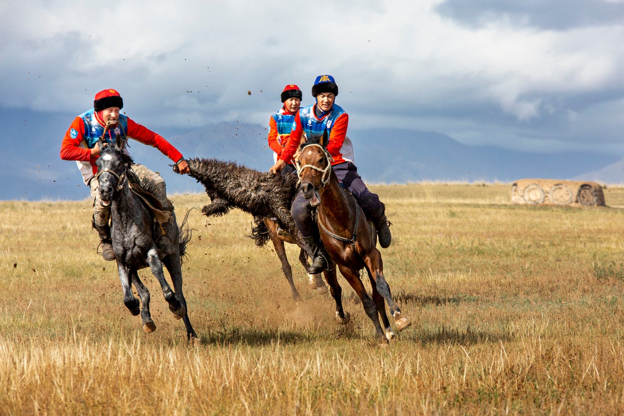 Nomadic horseriders play the traditional game of buzkashi, known also as kokpa, in Issyk Kul