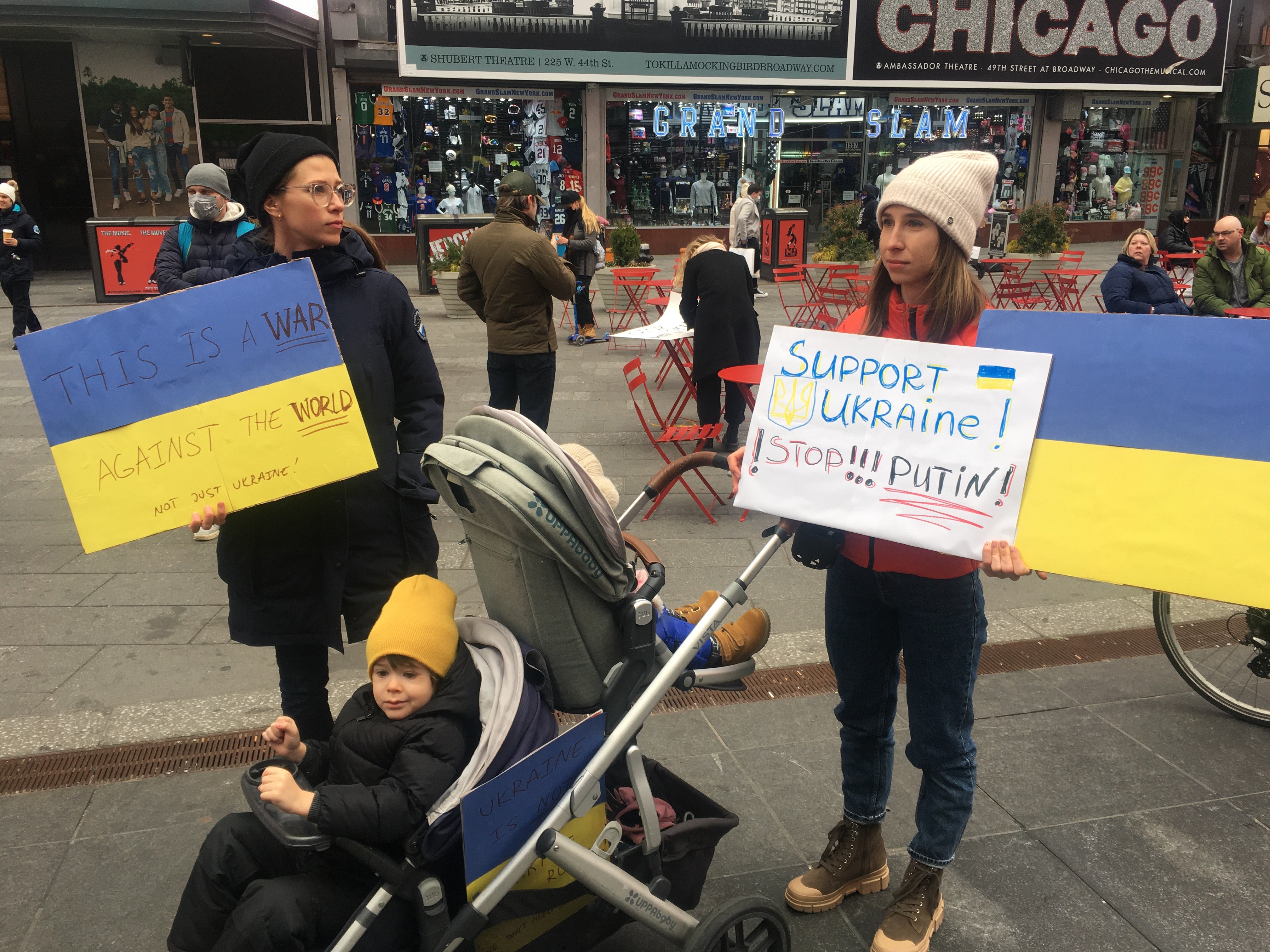 A Ukrainian family join the protests in Times Square on Thursday