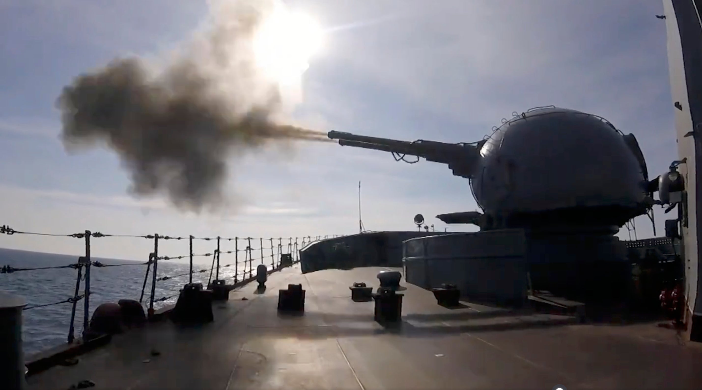 A Russian cruiser conducting an artillery battle and destroying a mock enemy submarine in Black Sea near Sevastopol