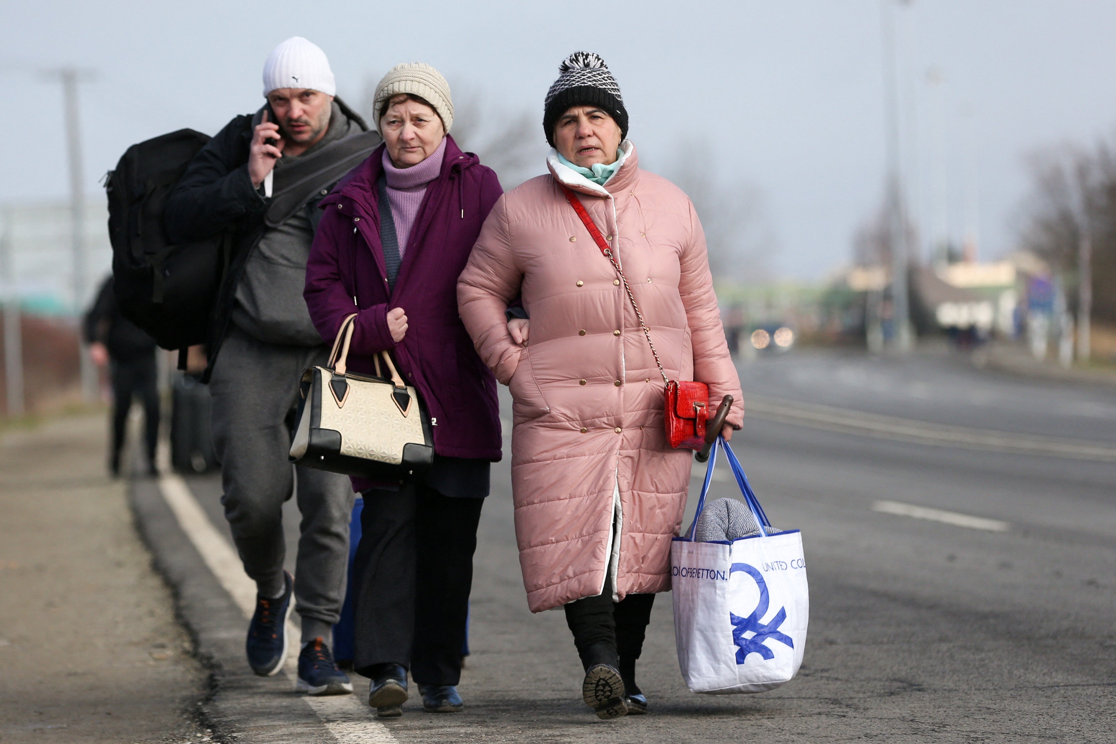 People fleeing Ukraine at the border with Hungary on Thursday