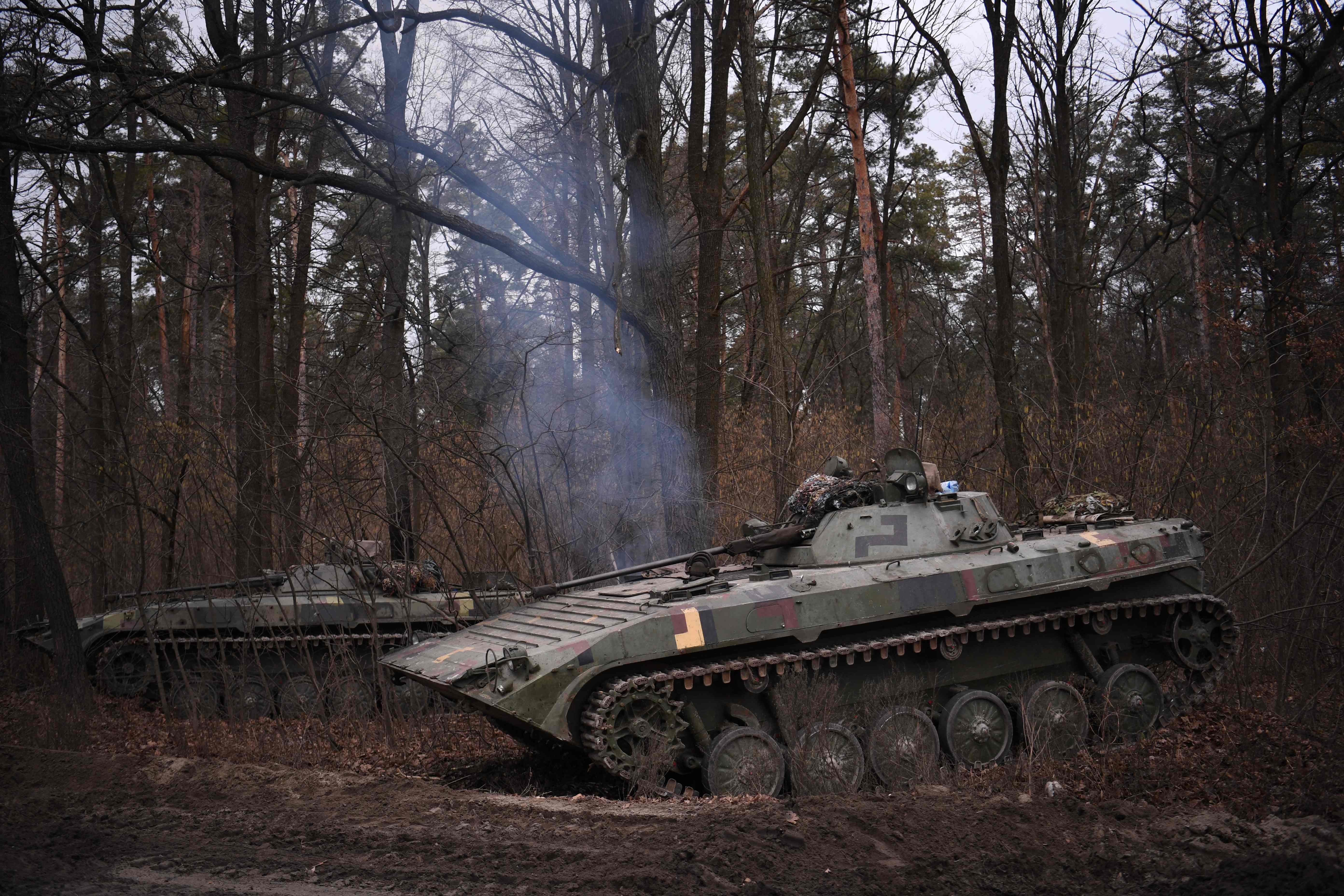 This photograph taken on 24 February 2022 shows an Ukrainian infantry combat vehicle BMP-2 standing guard on the outskirts of Kyiv