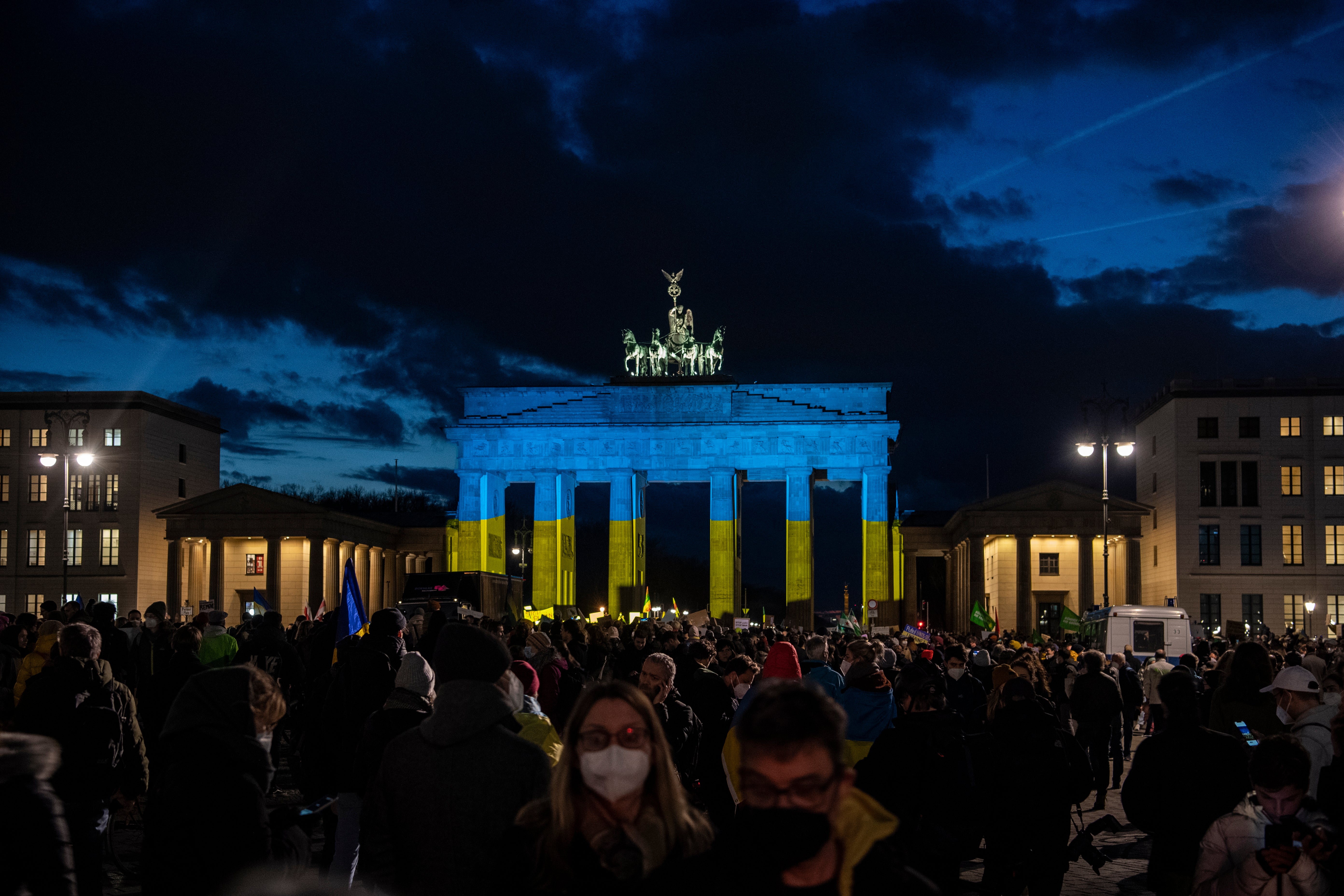 Brandenburg Gate illuminated in blue and yellow during a solidarity demonstration