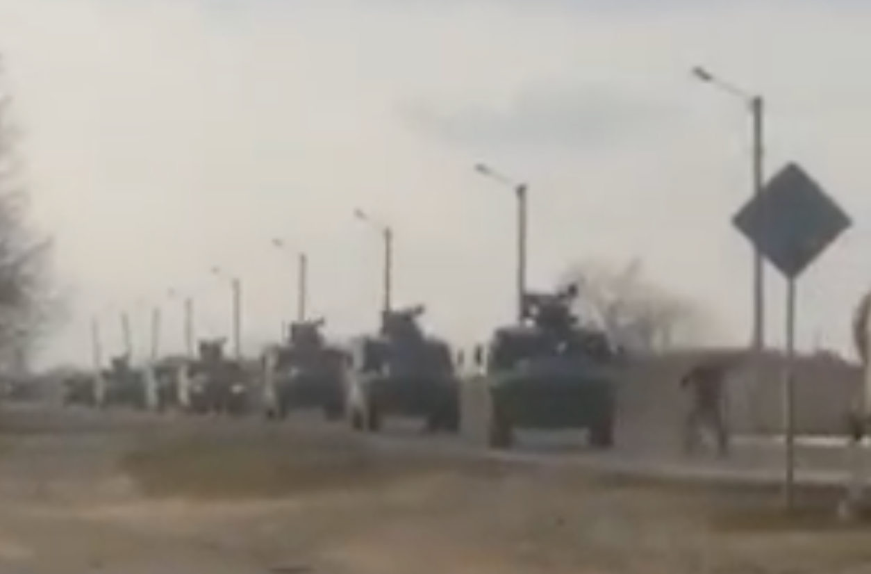 Viral video footage shows a Ukrainian man rushing into a column of Russian military vehicles