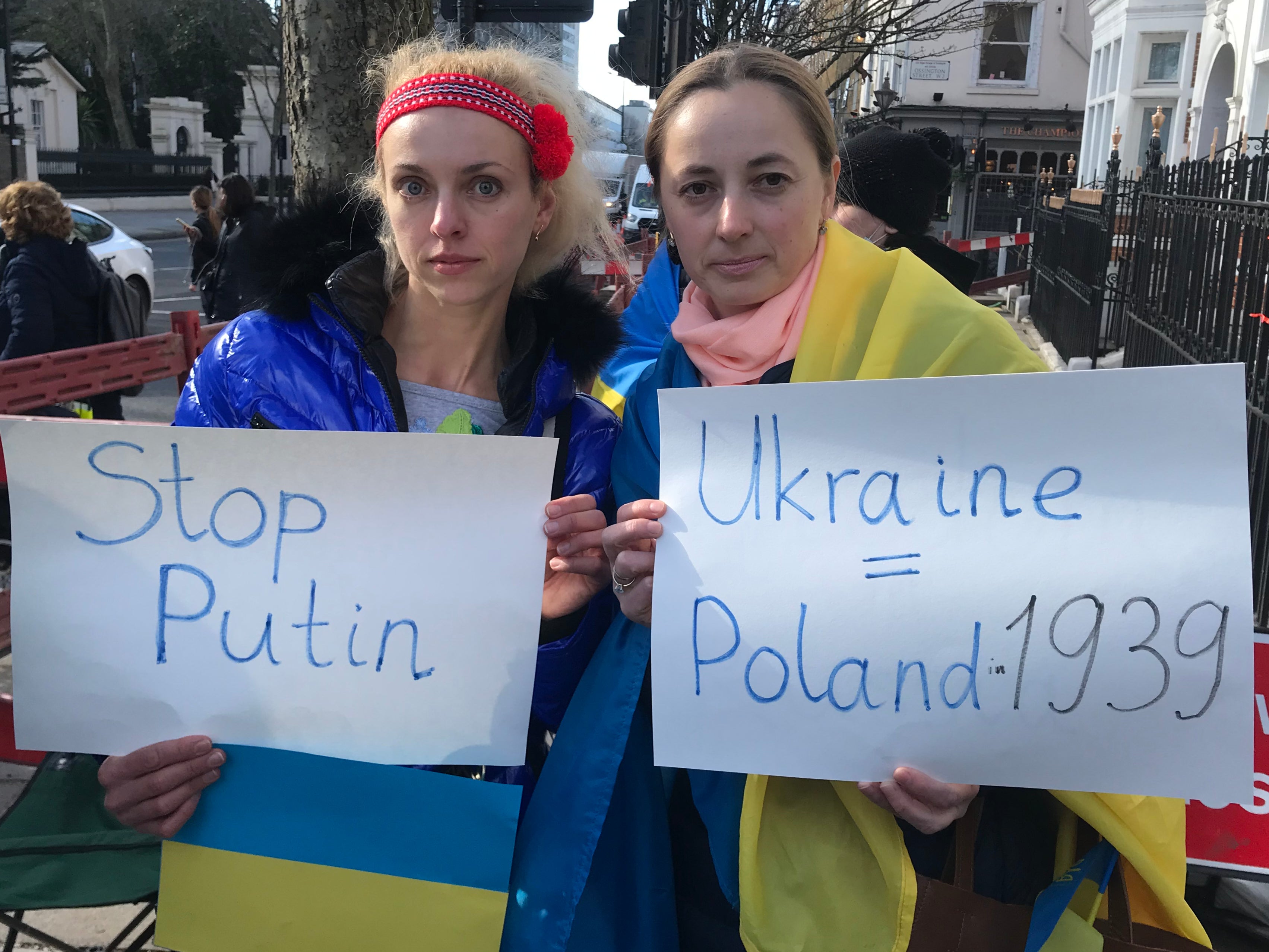 Ukrainians Olga Kuts (L) and Olga Marchenko (R) attend a protest outside the Russian embassy in London on 25 February 2022