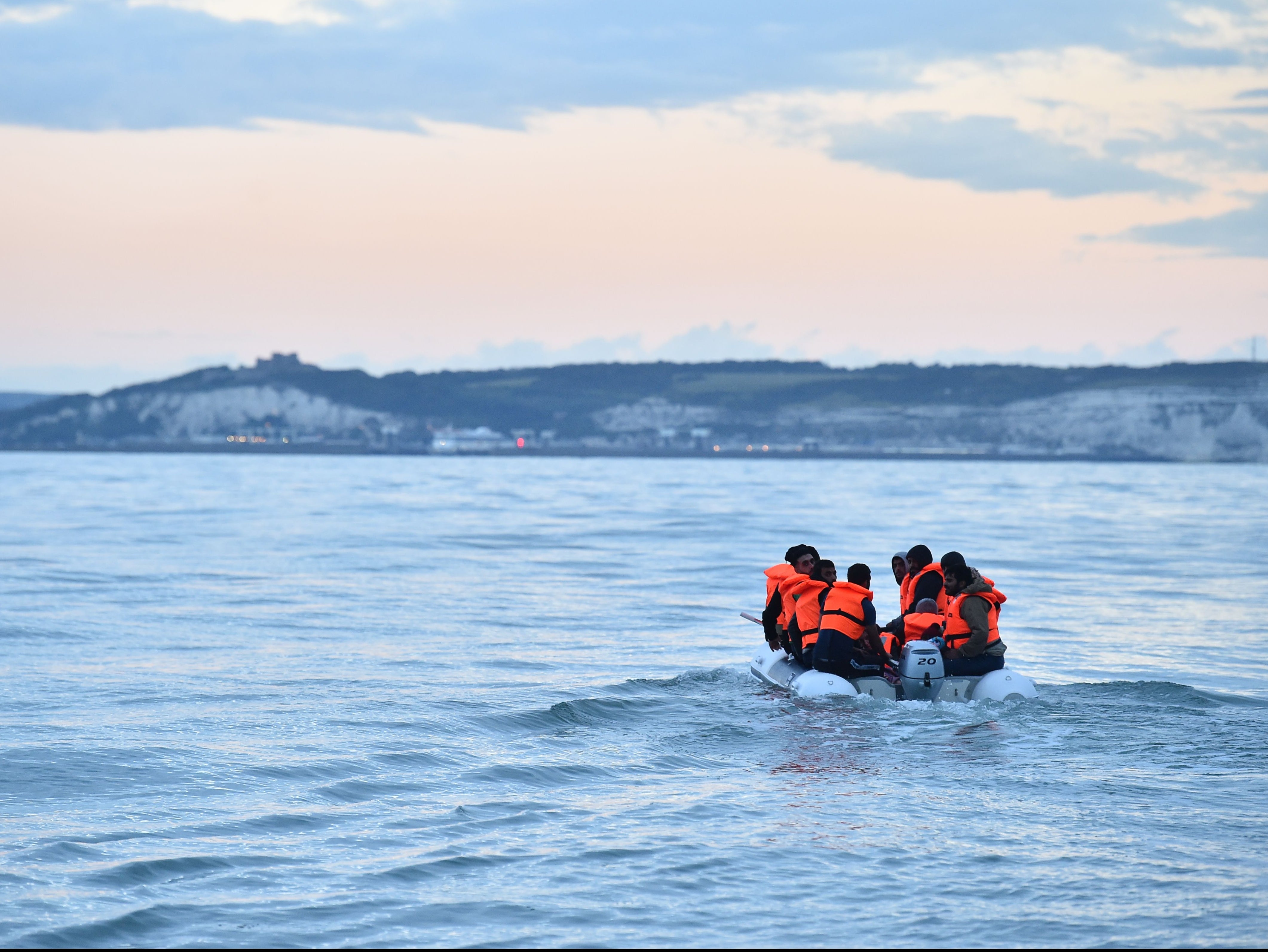 Migrants in a dinghy sail in the Channel toward the south coast of England in September 2020