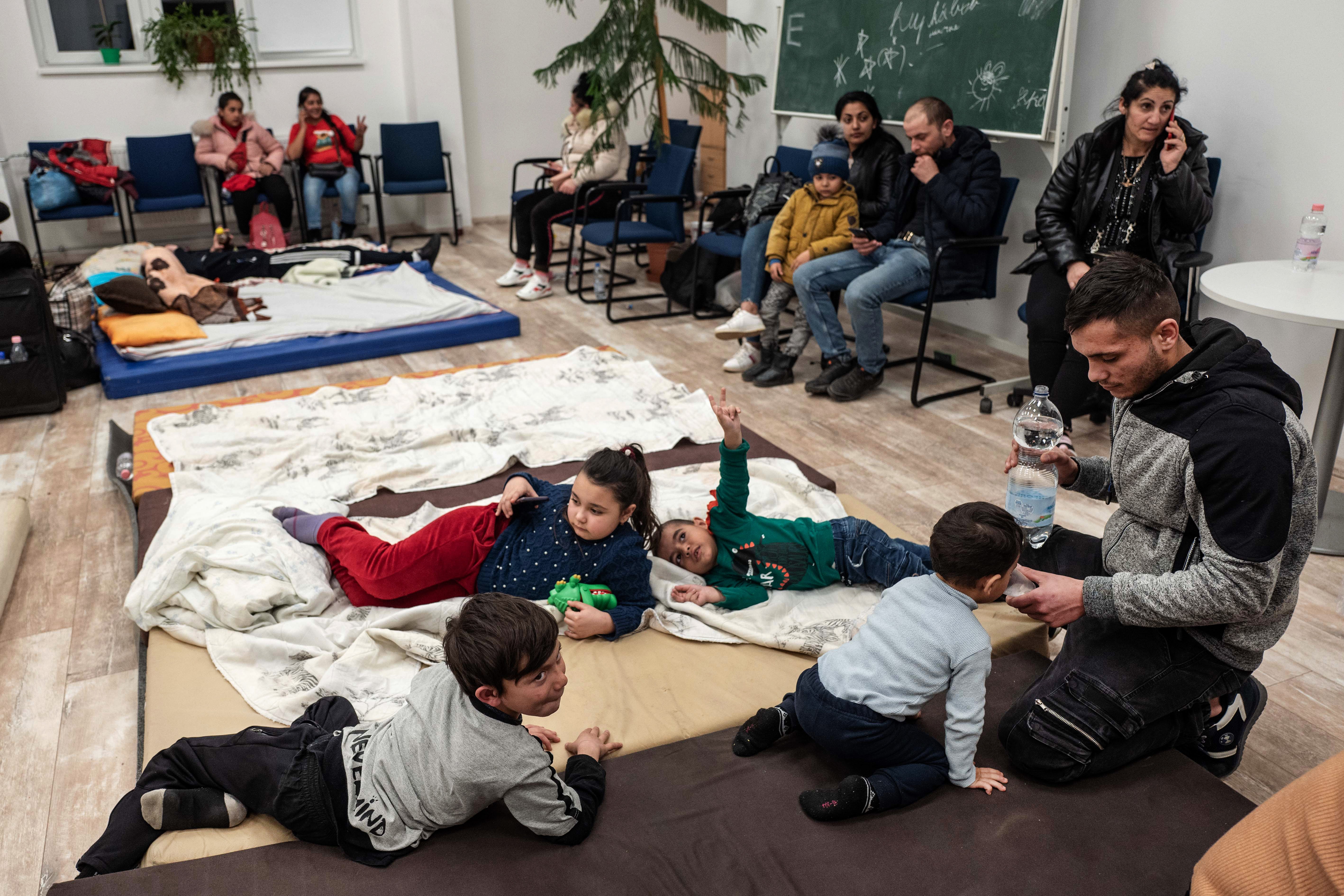 Refugees at a temporary shelter over the Hungarian border after fleeing Ukraine