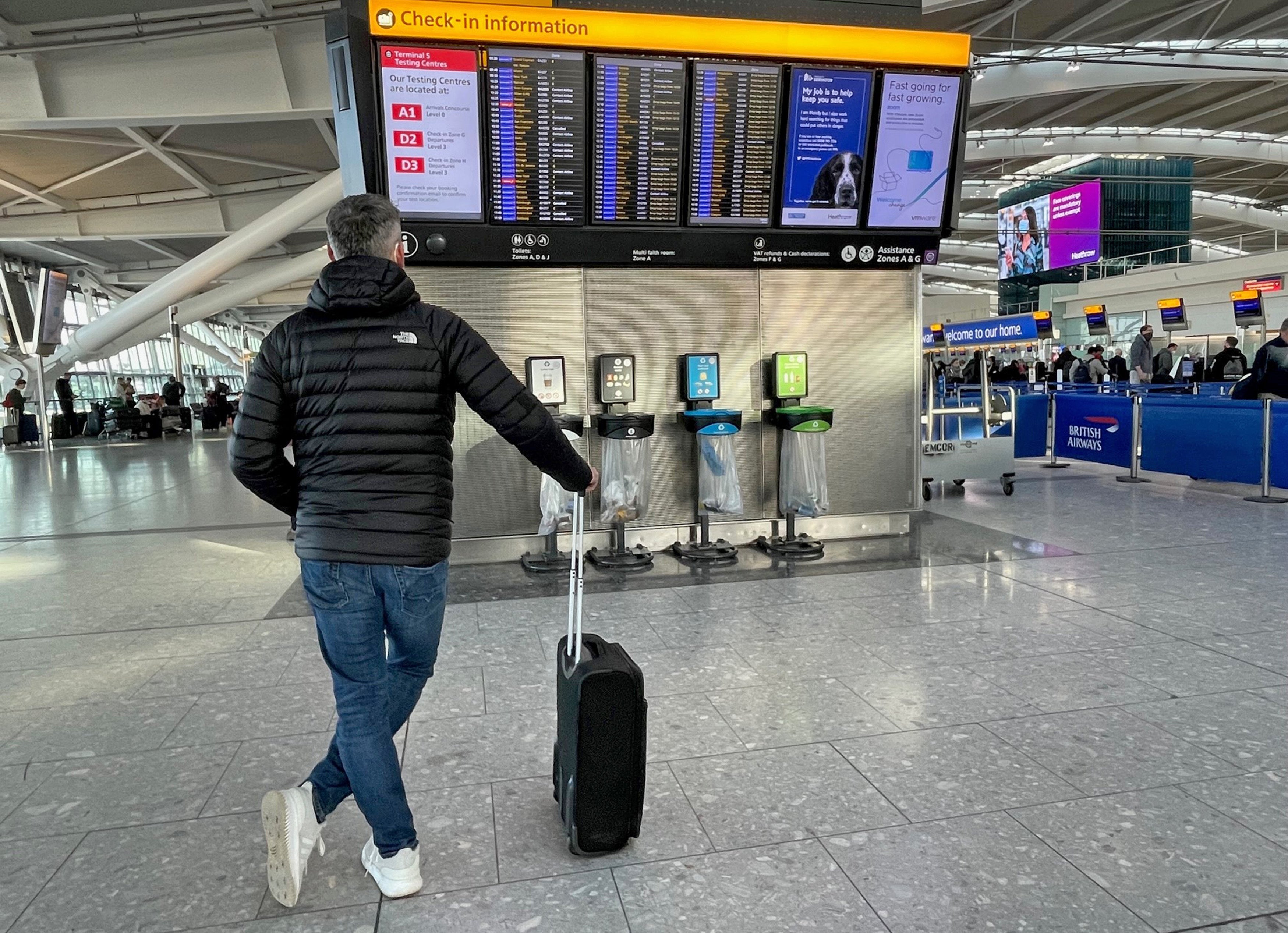 Passengers at Heathrow Airport T5 (PA)