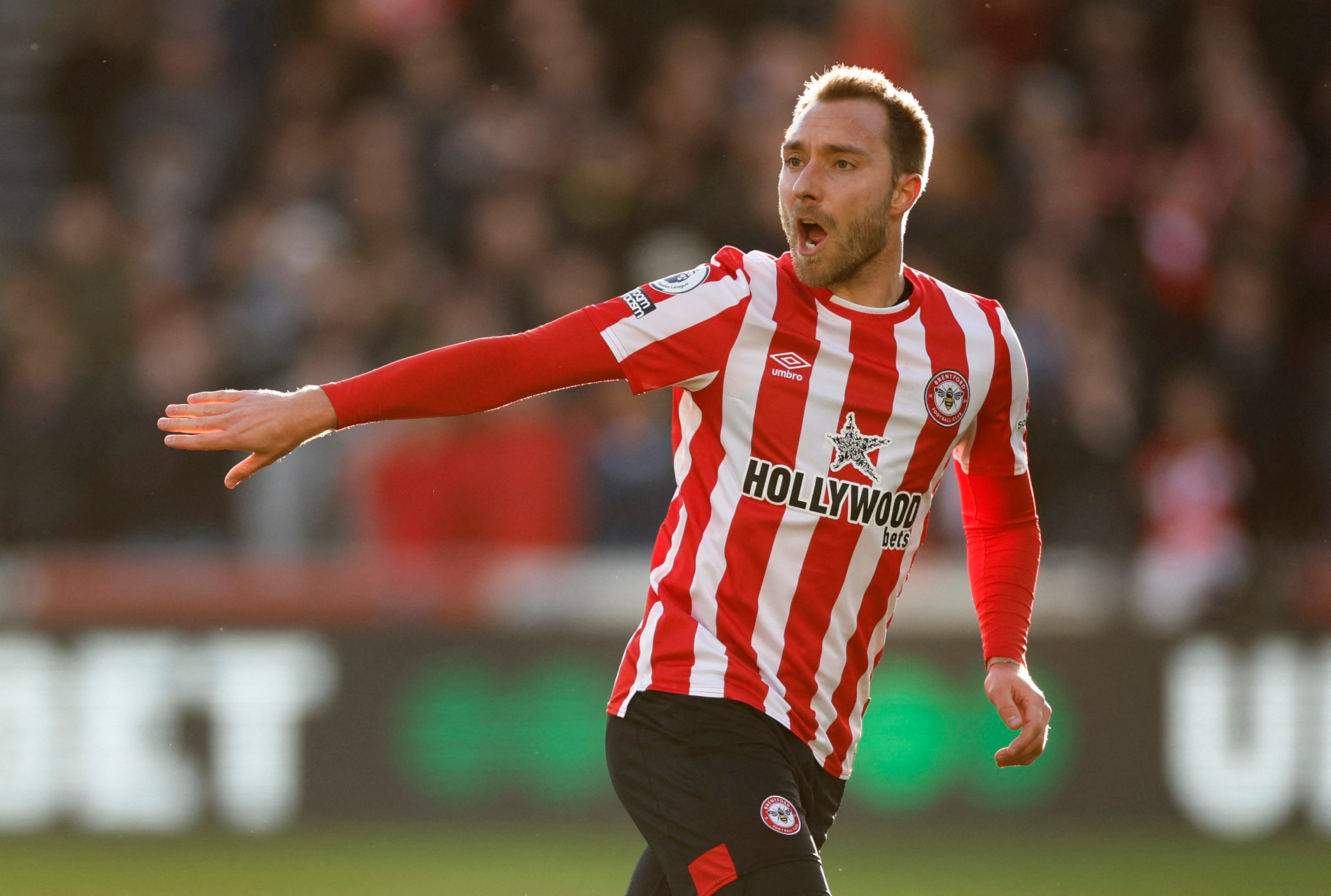 Christian Eriksen arrived on the pitch to a standing ovation