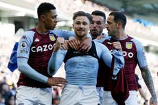 Matty Cash: Aston Villa defender booked after removing shirt to reveal support of family in Ukraine