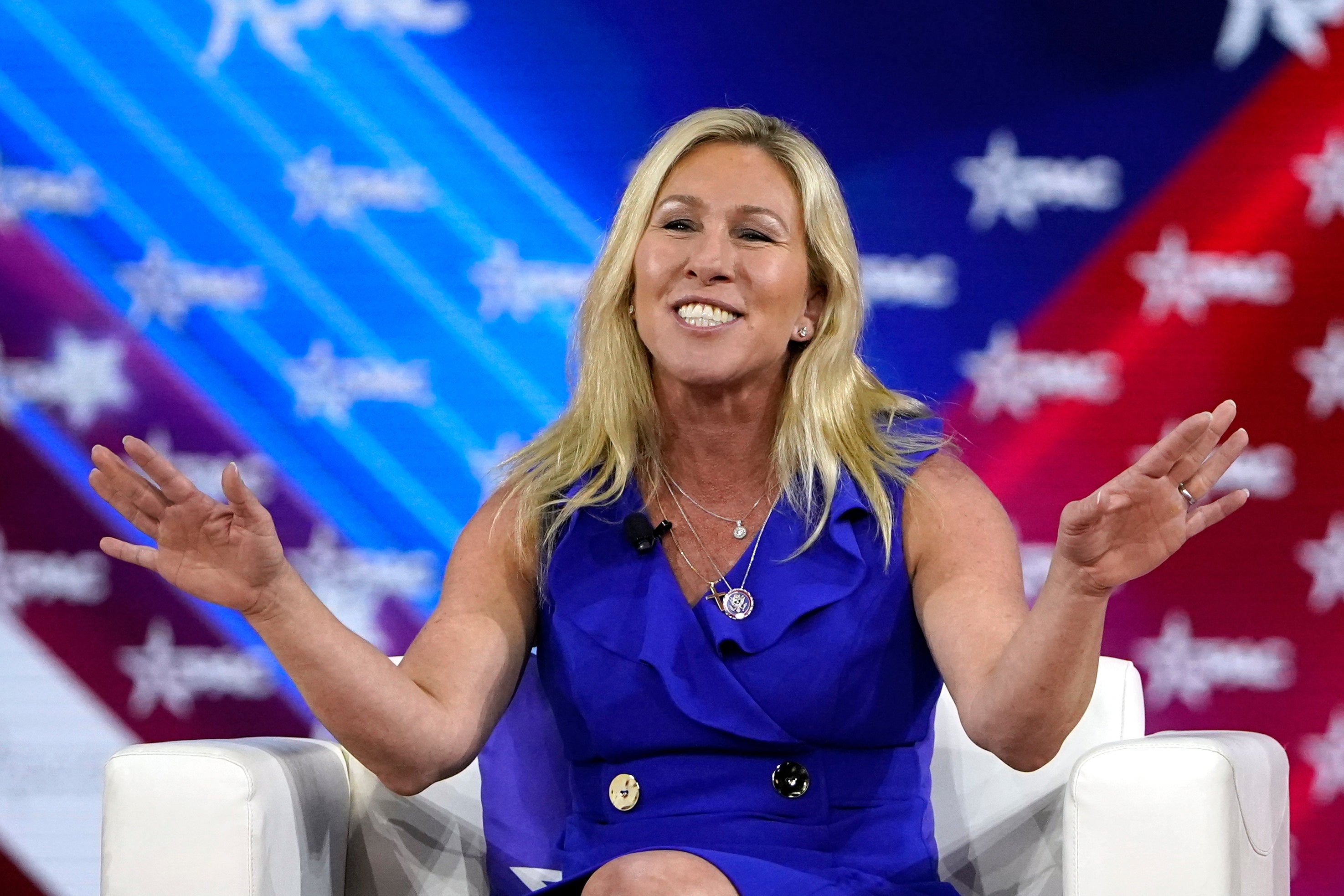 Rep Marjorie Taylor Greene answers questions during a panel discussion at CPAC