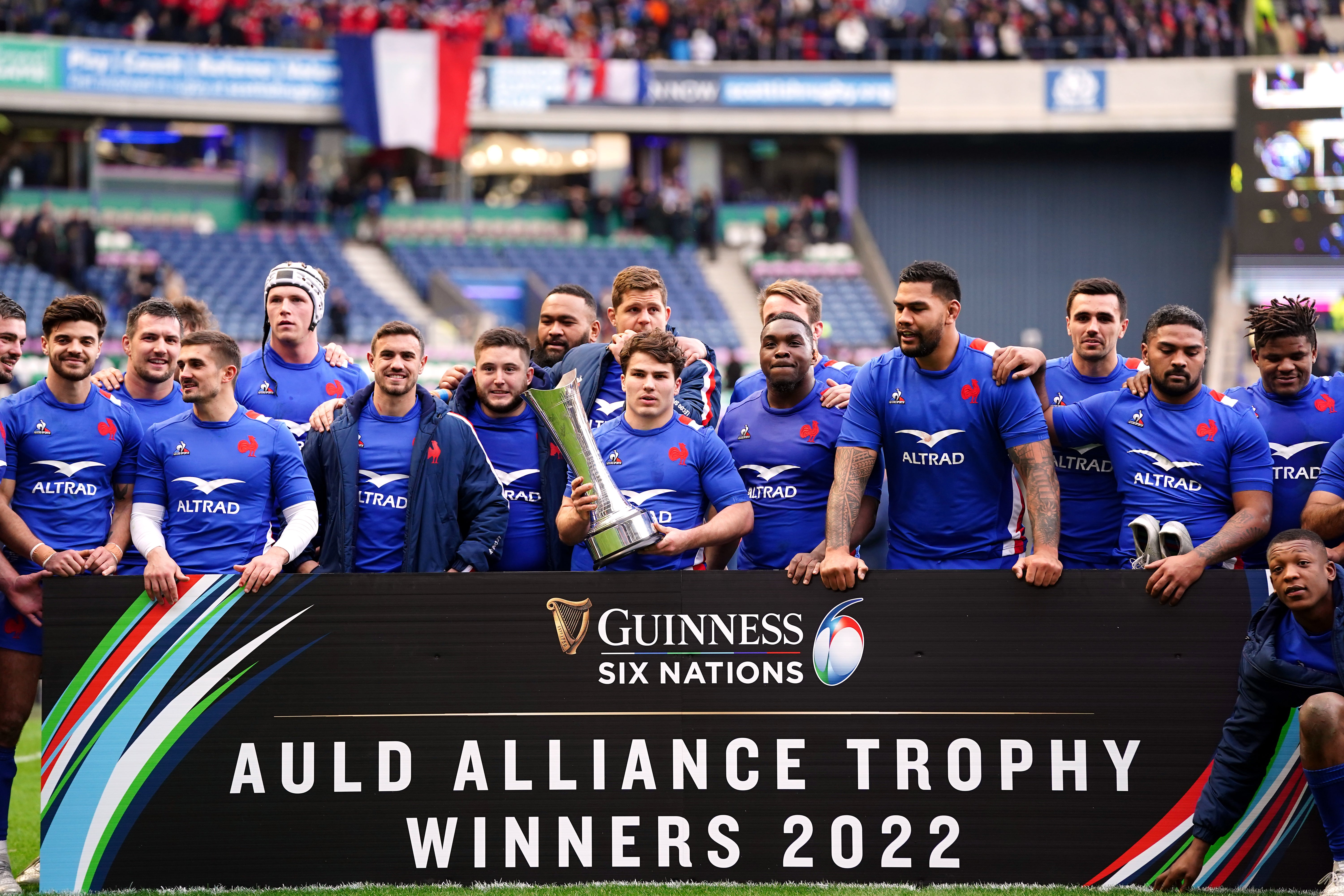 France’s Antoine Dupont with the Auld Alliance Trophy after the win