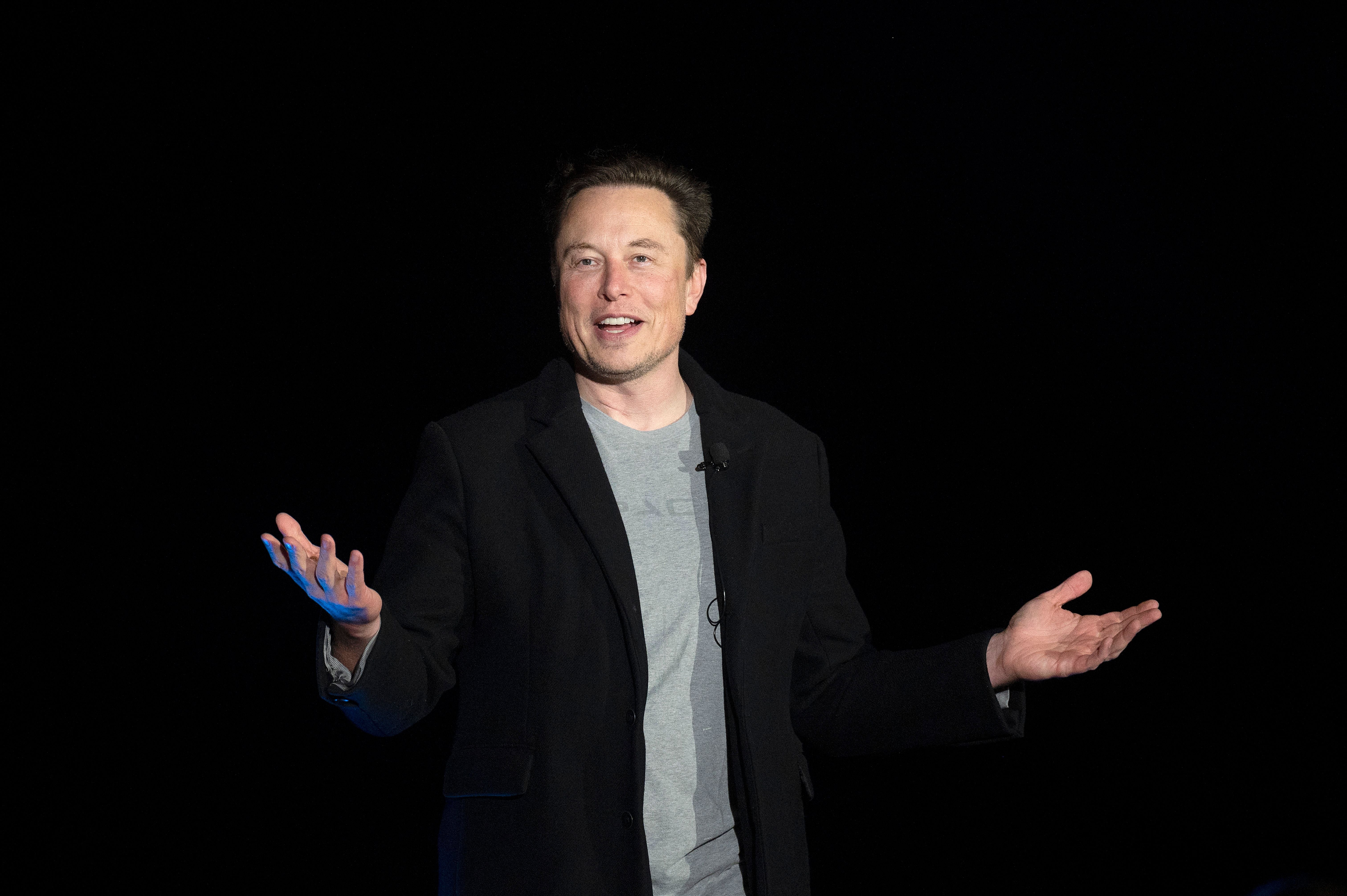 Elon Musk gestures as he speaks during a press conference at SpaceX's Starbase facility near Boca Chica Village in South Texas on February 10, 2022.