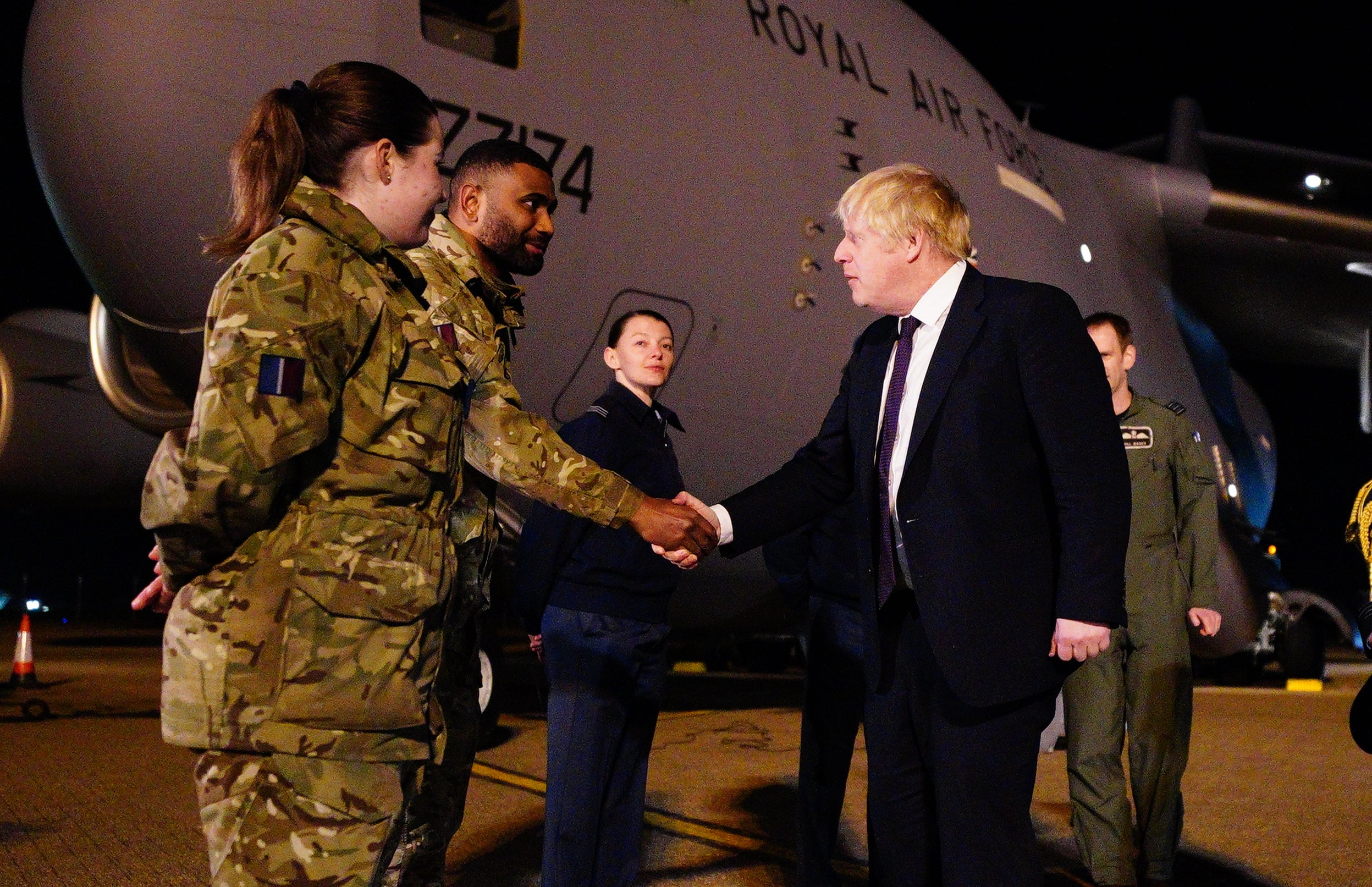 Boris Johnson meeting military personnel at RAF Brize Norton (Ben Birchall/PA)