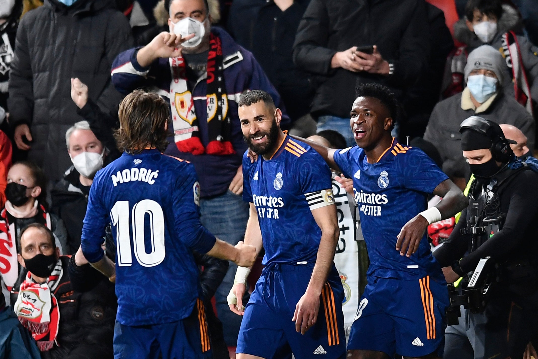 Karim Benzema, centre, celebrates Real Madrid’s winner against Rayo Vallecano (Jose Breton/AP)