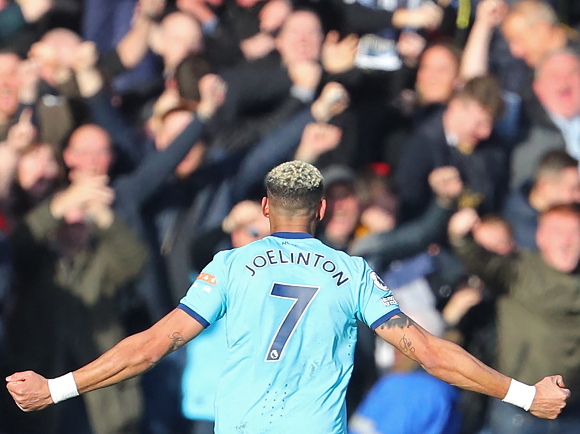 Joelinton celebrates in front of Newcastle’s fans