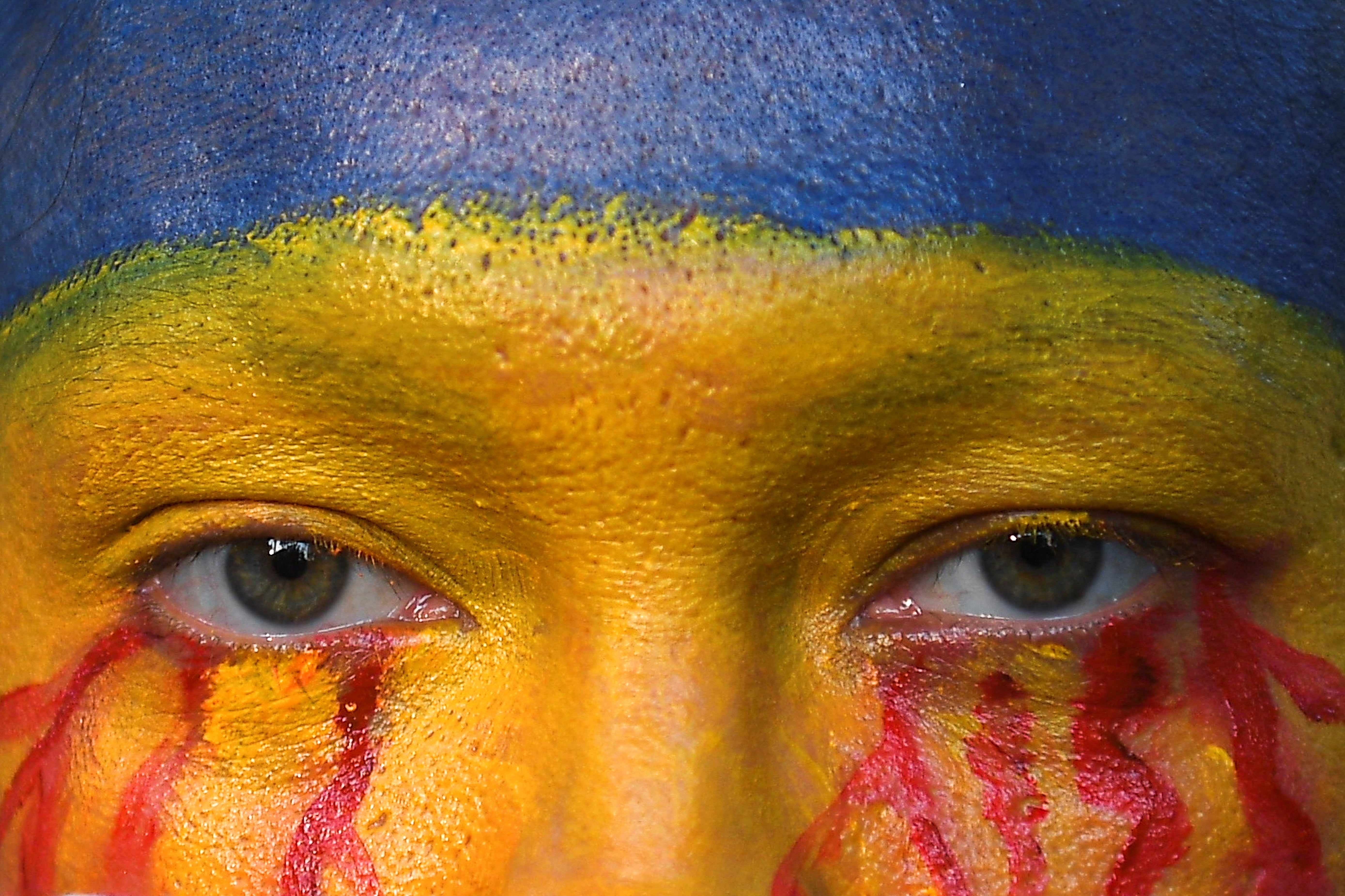 Lidiya Zhuravlyova, a Ukraine-born performance artist, looks on as she takes part in an anti-war protest, after Russia launched a massive military operation against Ukraine, in Bangkok, Thailand February 27, 2022