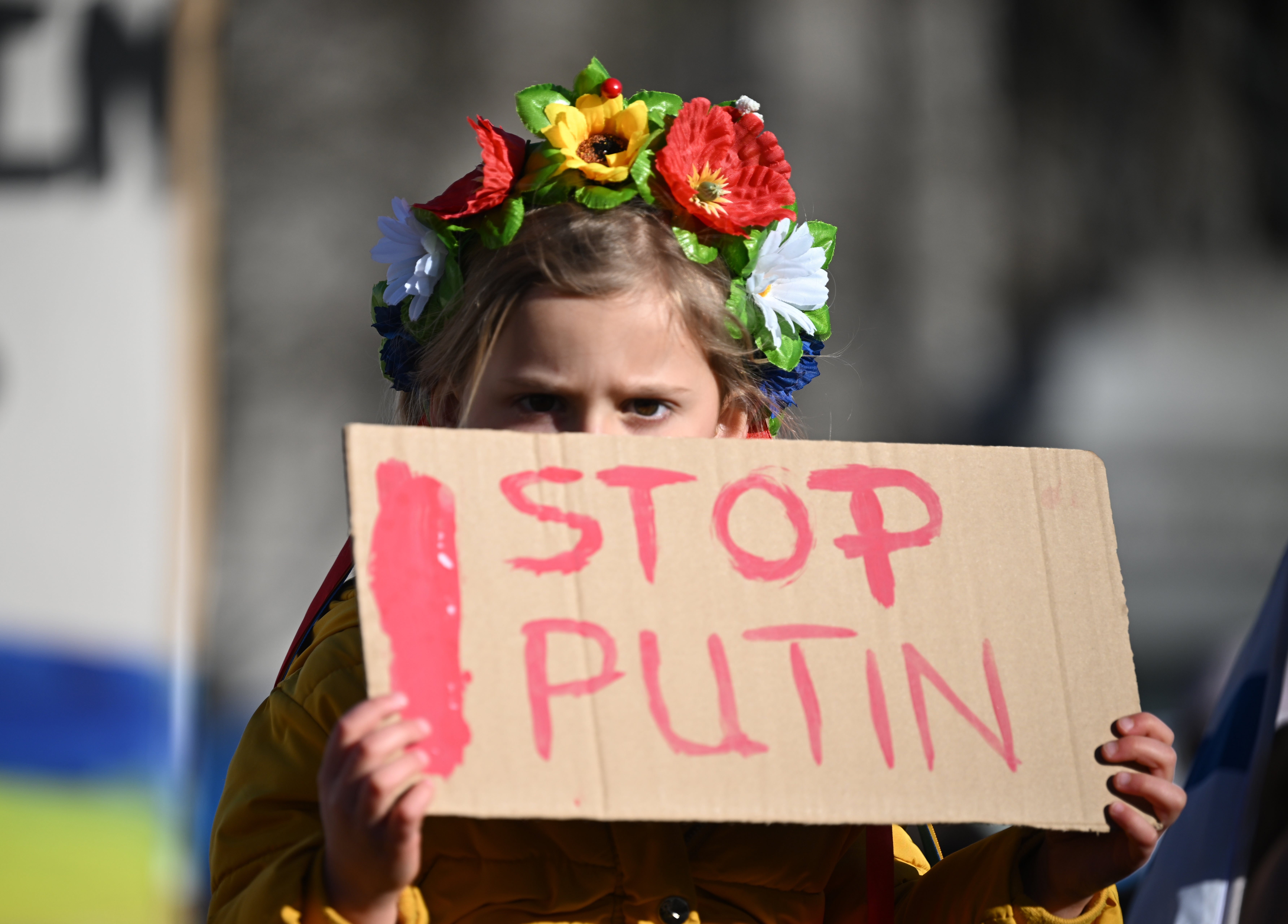 A protester holds a placard saying ‘Stop Putin’ as they gather for a demonstration in support of Ukraine in Trafalgar Square