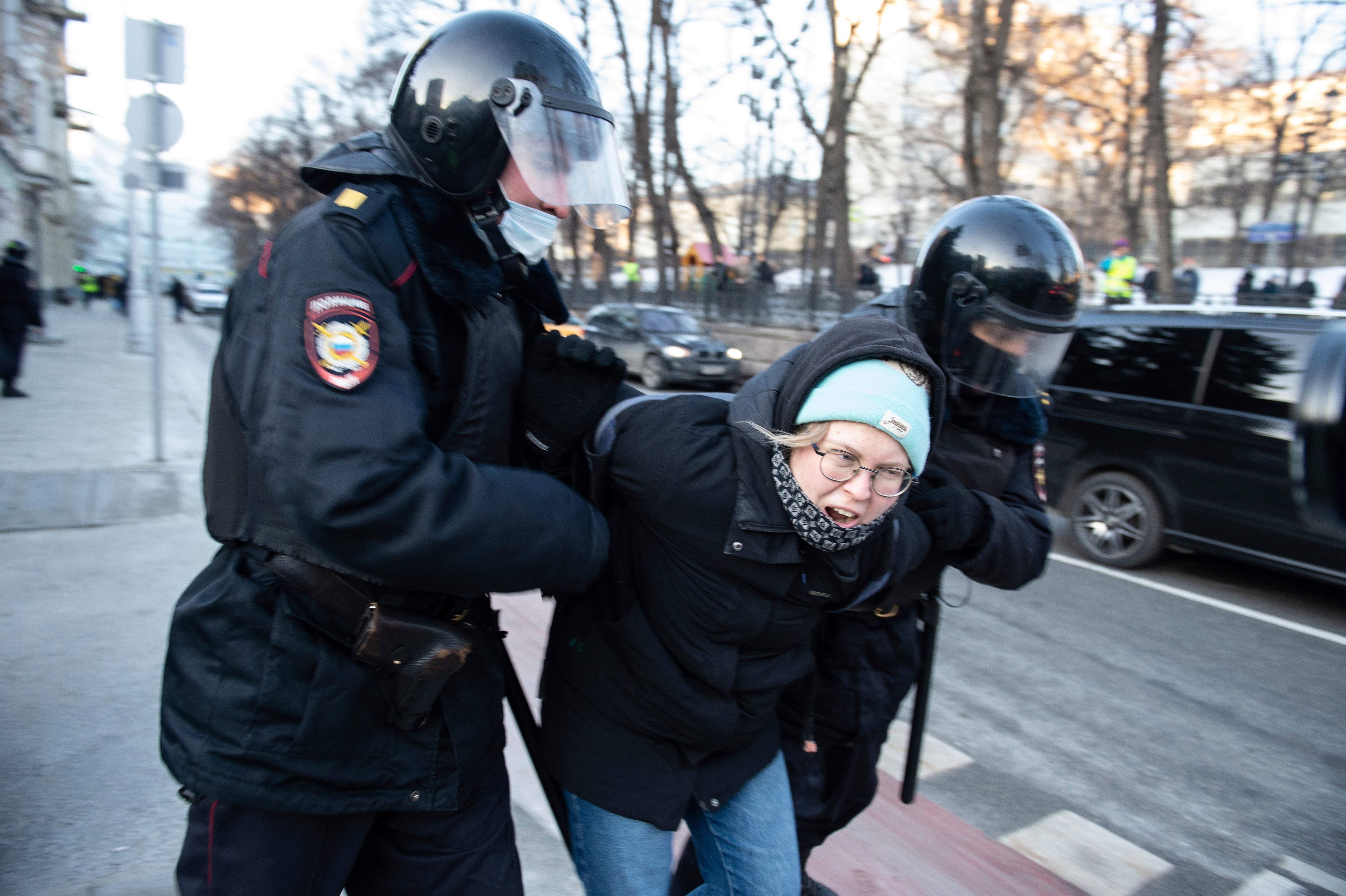 Police detain a demonstrator during an action against Russia's attack on Ukraine in Moscow, Russia, Sunday, Feb. 27, 2022.