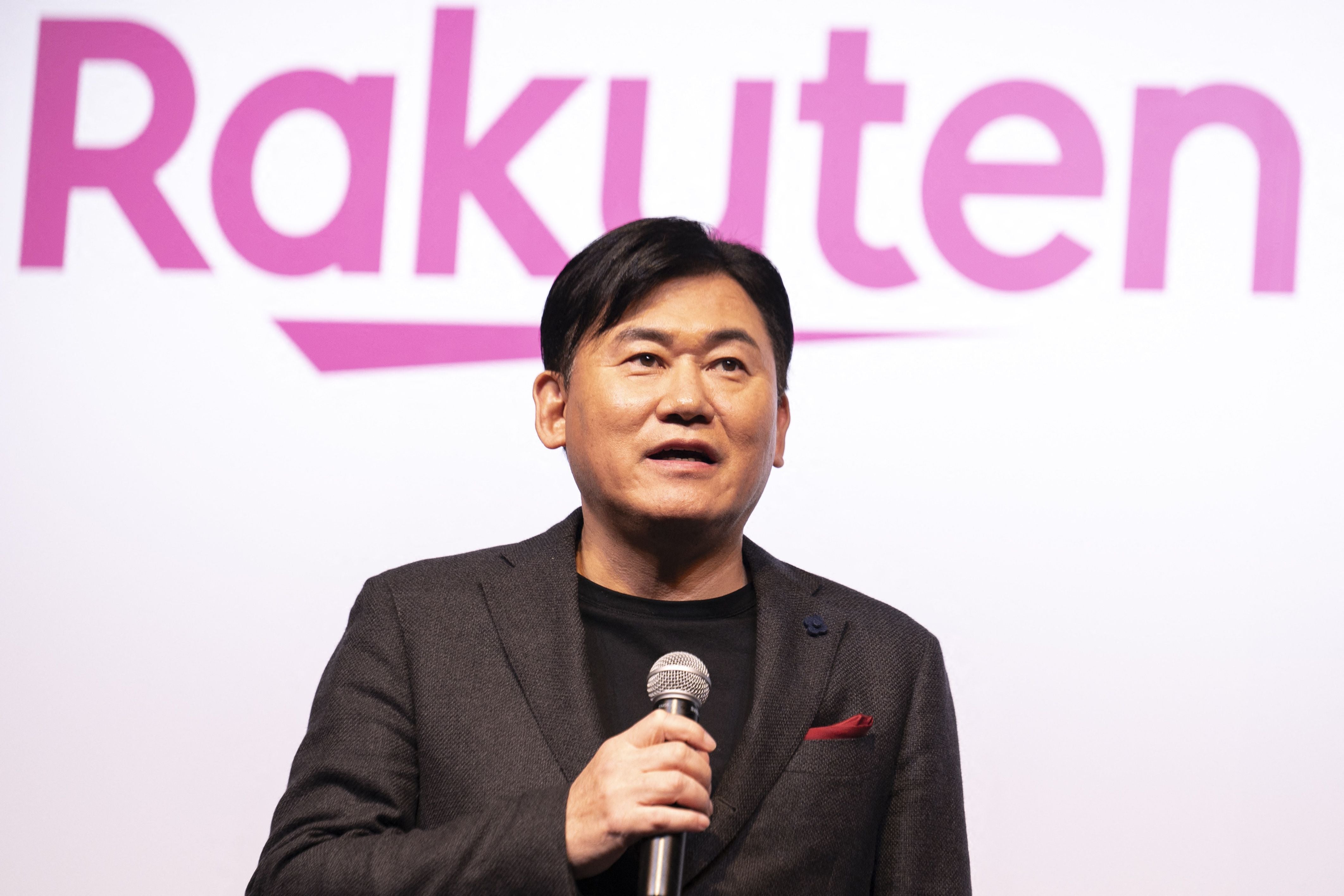 Rakuten group's CEO Hiroshi Mikitani delivers a speech during a Rakuten Mobile press conference in Tokyo