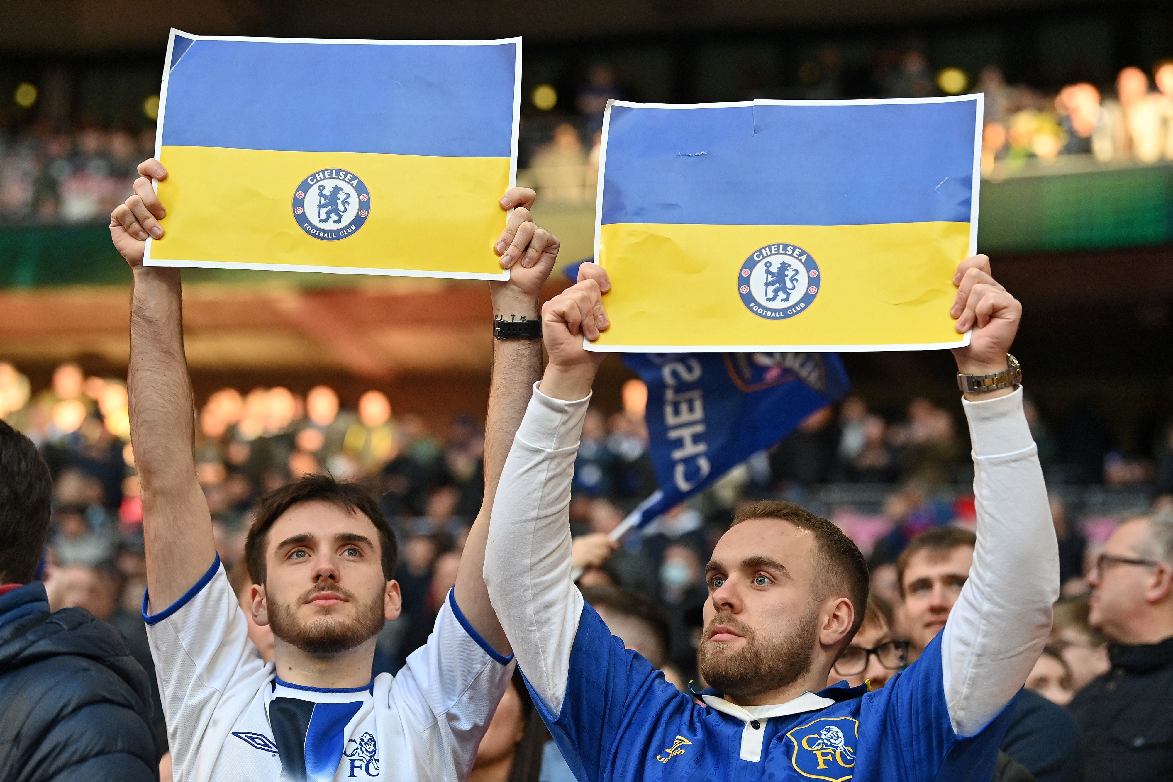 Chelsea fans hold up the flag of Ukraine at Wembley