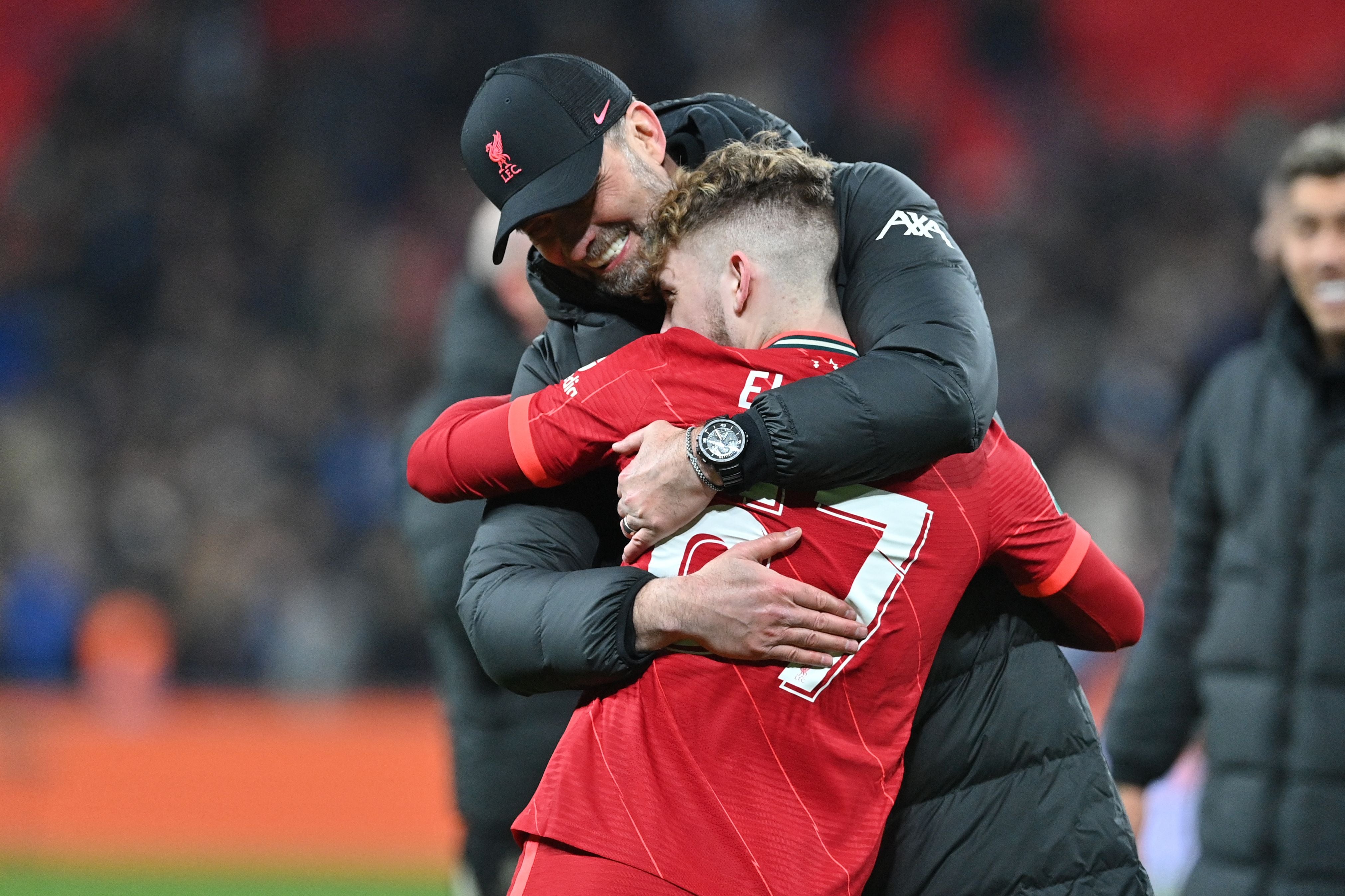 Jurgen Klopp embraces teenager Harvey Elliott after the match