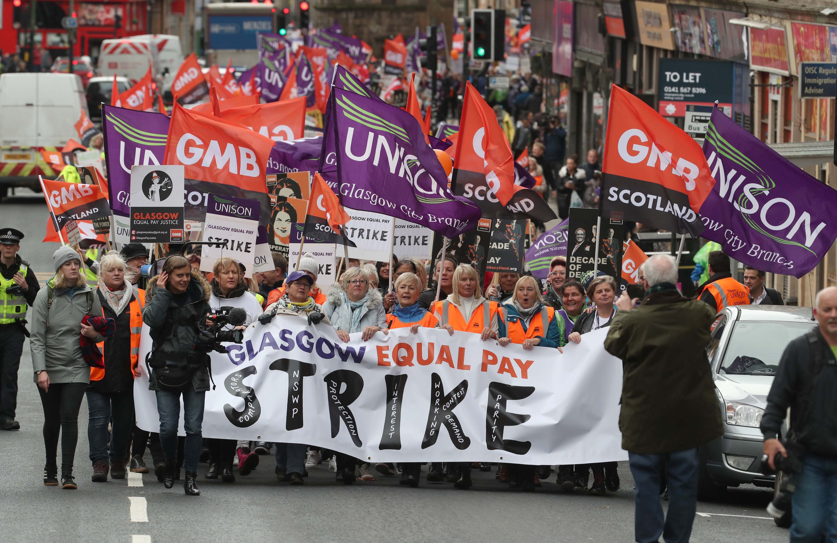 Strikers march through Glasgow city centre (Andrew Milligan/PA)