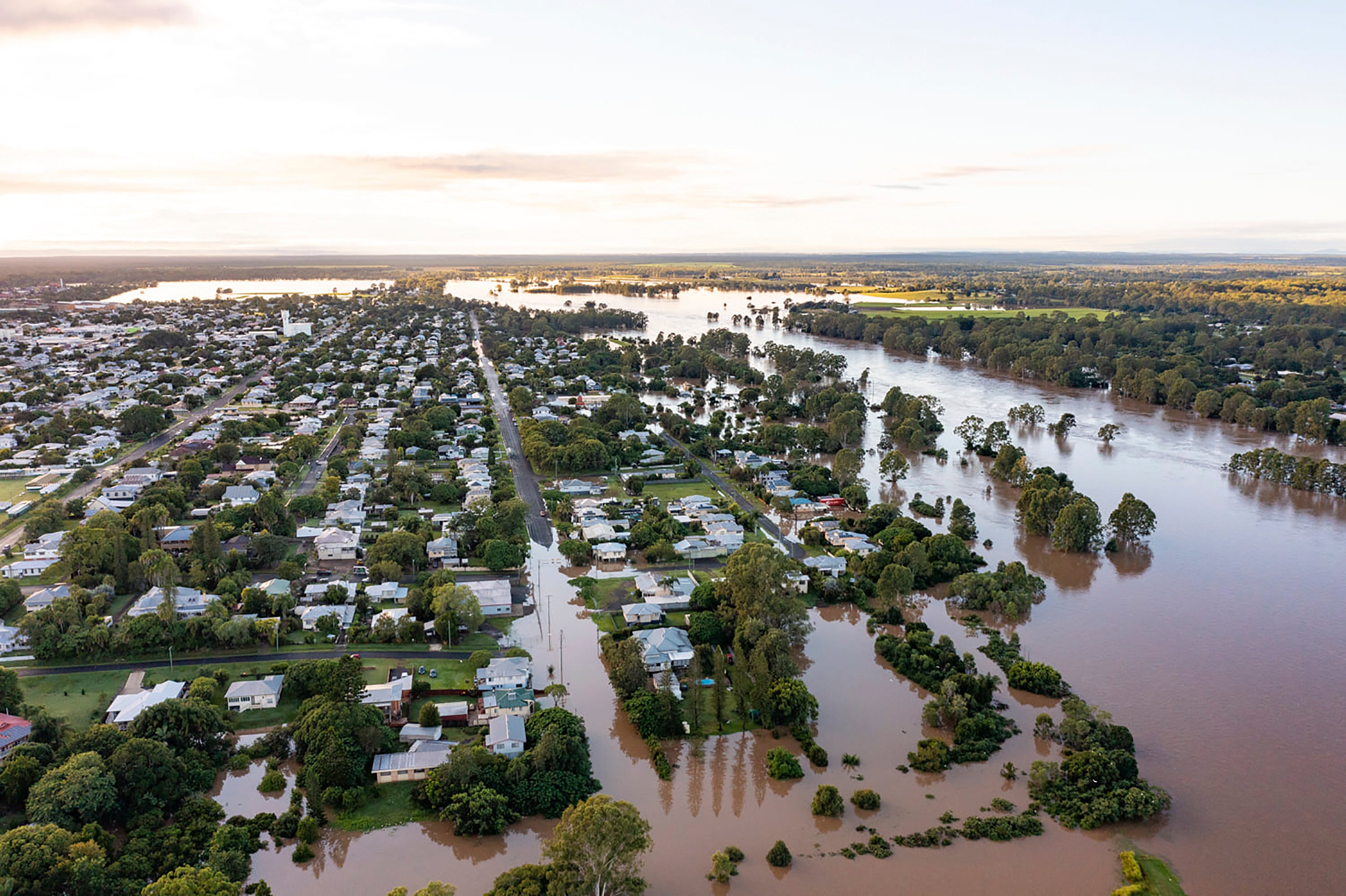 In this photo provided by the Fraser Coast Regional Council, water floods streets and houses in Maryborough, Australia on 28 February 2022. Heavy rain is bringing record flooding to some east coast areas while the flooding in Brisbane, a population of 2.6 million, and its surrounds is the worst since 2011 when the city was inundated by what was described as a once-in-a-century event