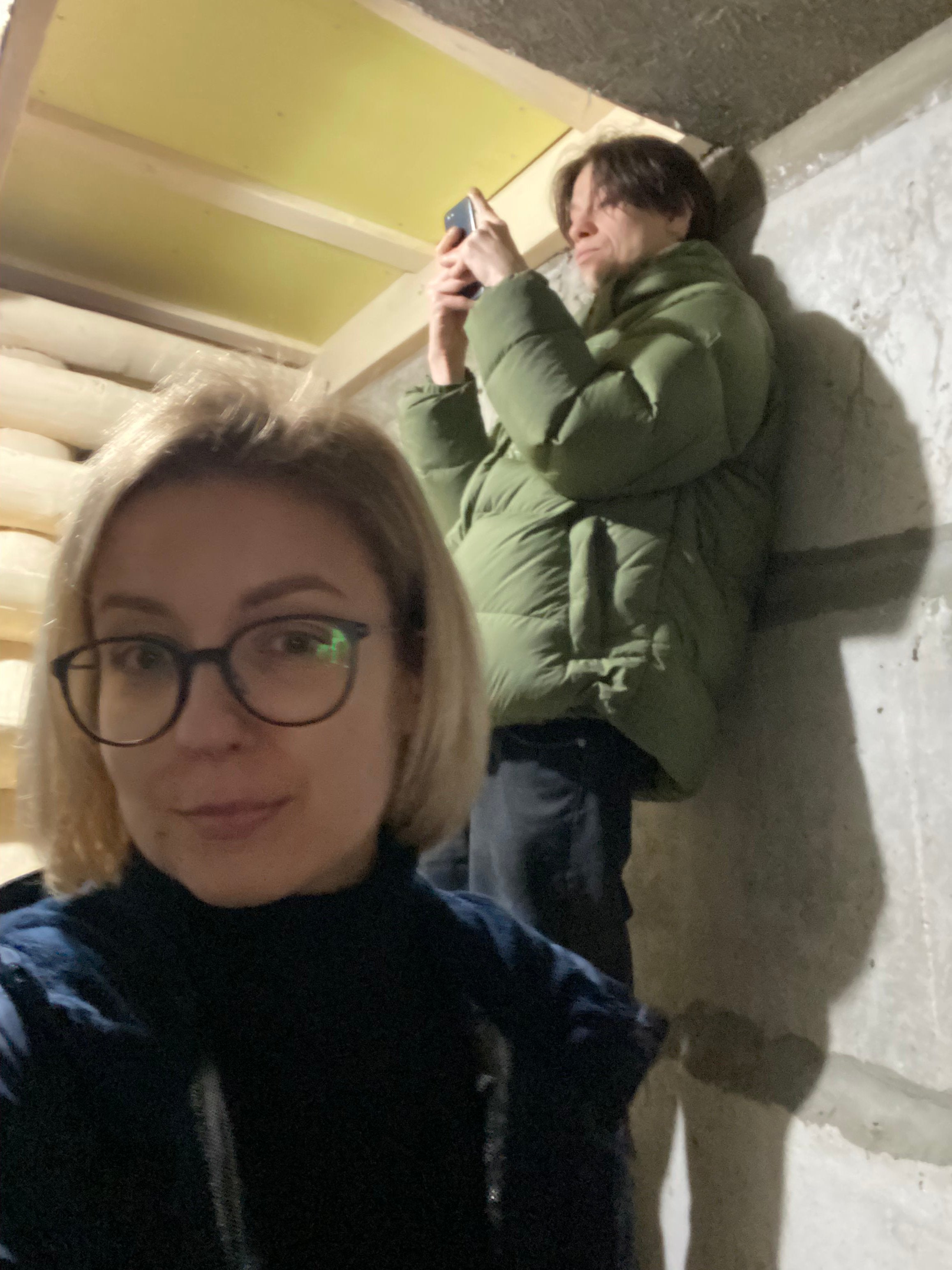 Inna Sovsun has been hiding at a friend’s house in Kyiv, where she is pictured in the basement here with her brother (Inna Sovsun)