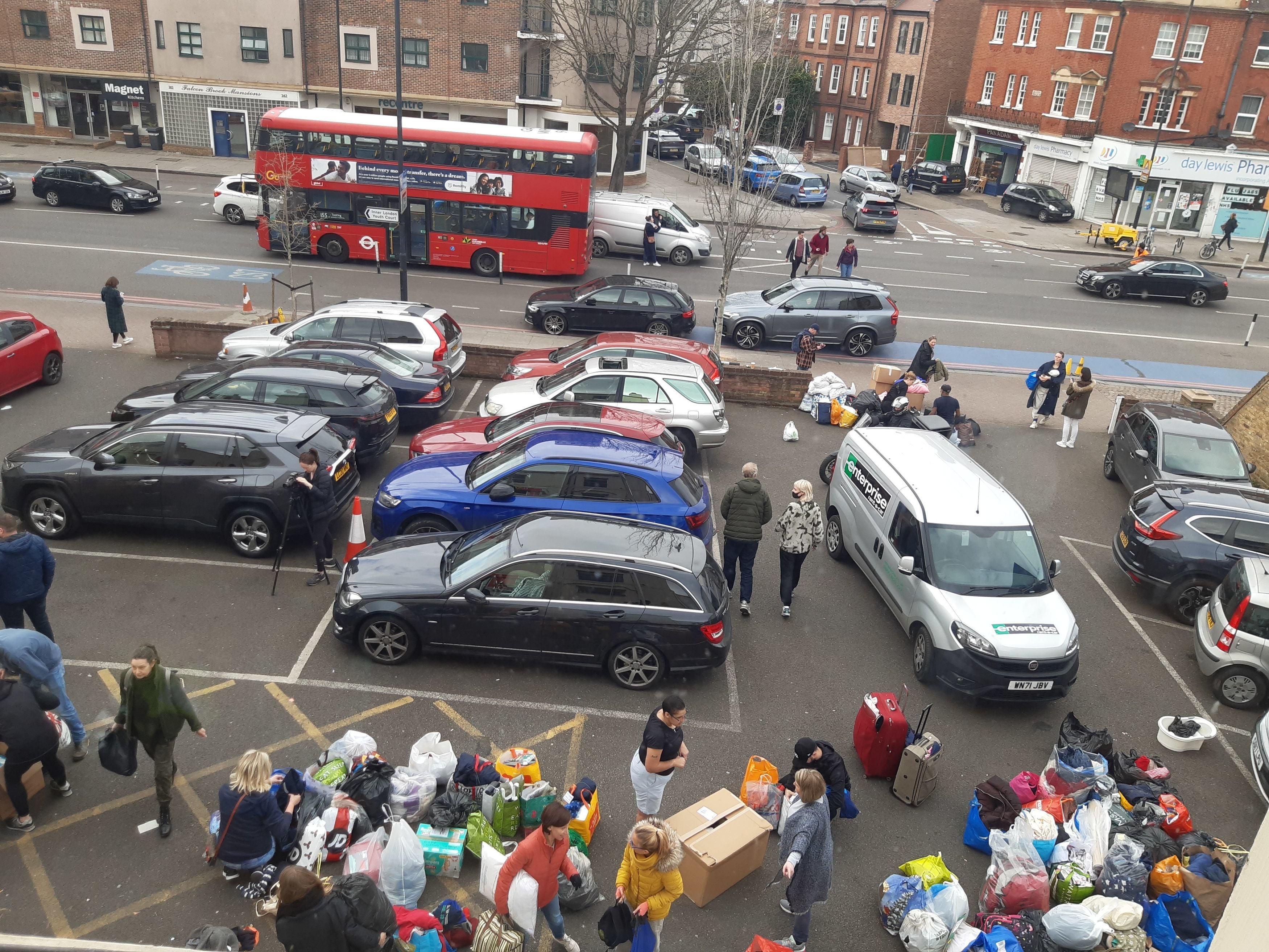 Members of the public drop off donations to the Polish White Eagle Club (Helen William/PA)