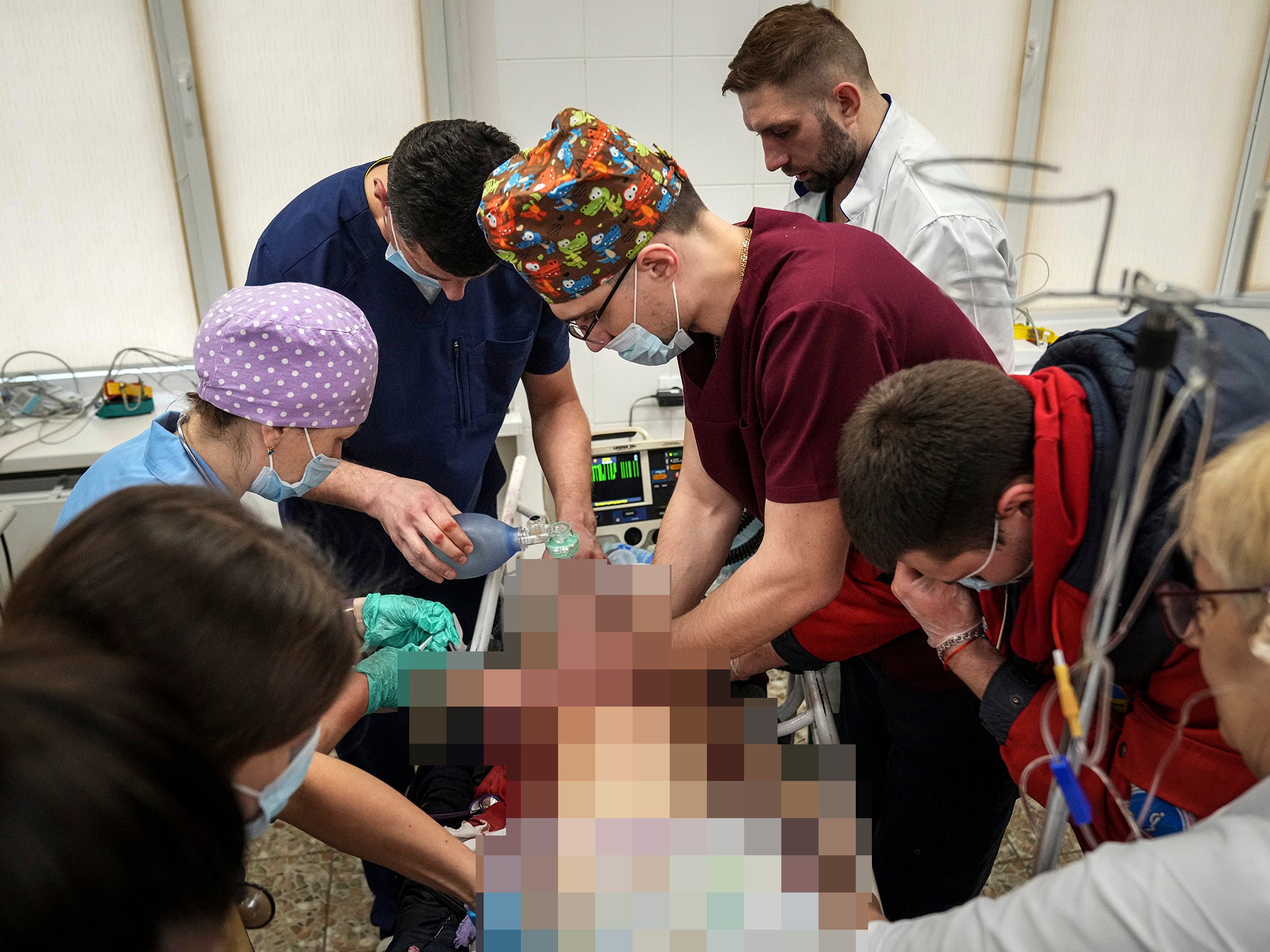 Medics perform CPR on a girl injured during shelling residential area, at the city hospital of Mariupol,