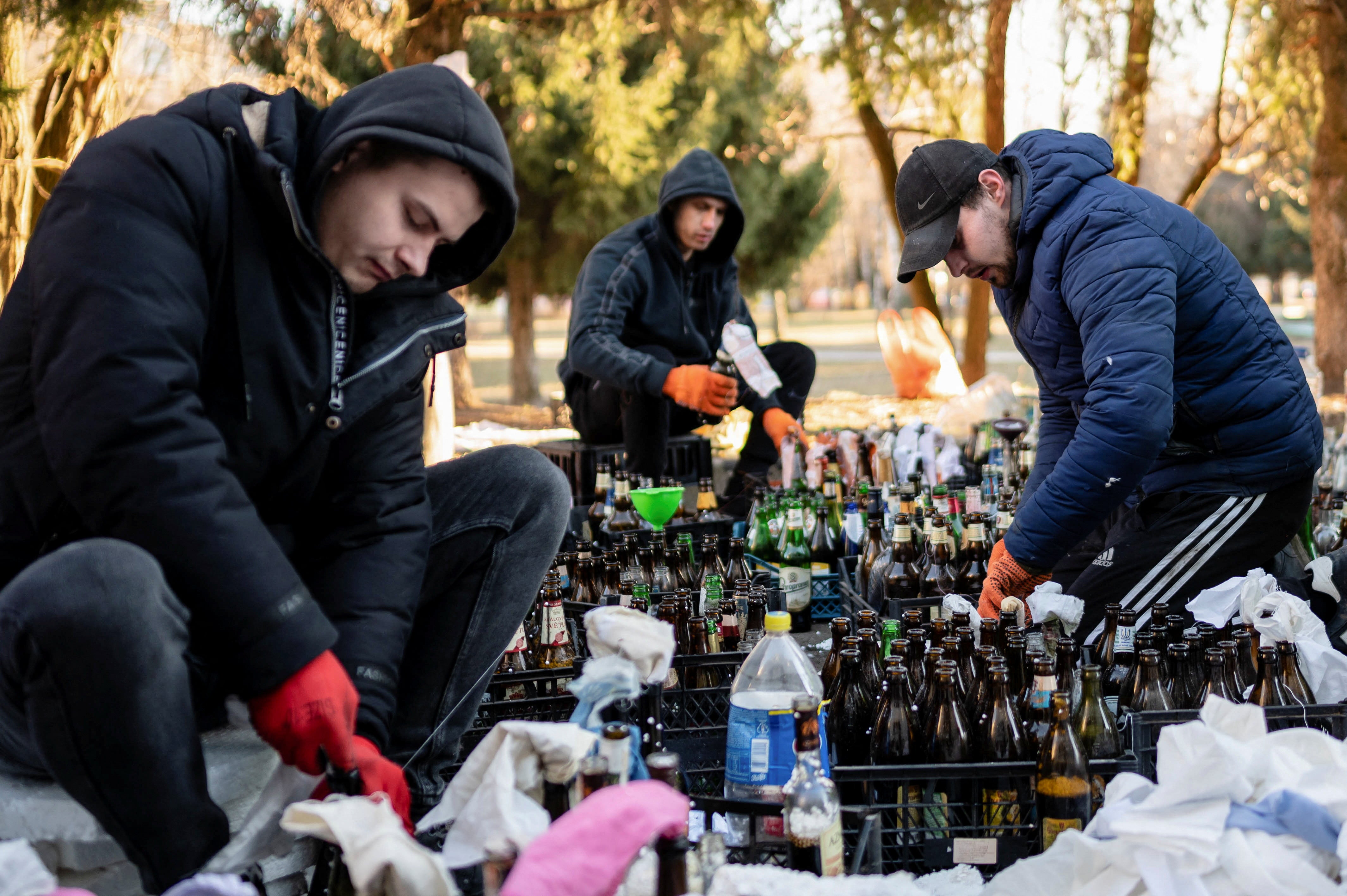 Local residents prepare Molotov cocktails